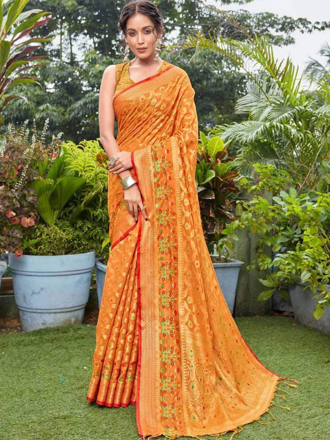 

Mitera Orange & Pink Floral Woven Design Zari Organza Patola Saree