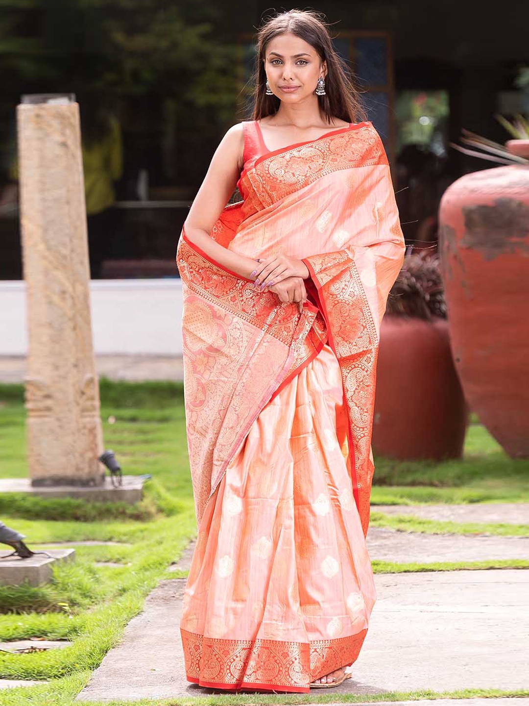 

Mitera Coral & Gold-Toned Ethnic Motif Woven Design Zari Banarasi Saree