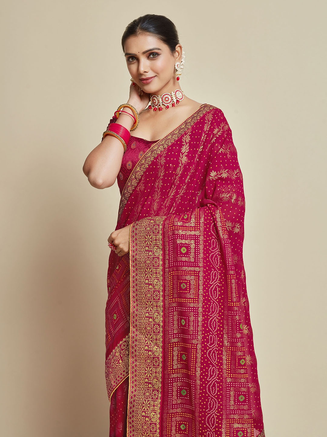 

Sangria Pink Woven Design Zari Detail Poly Georgette Bandhani Saree