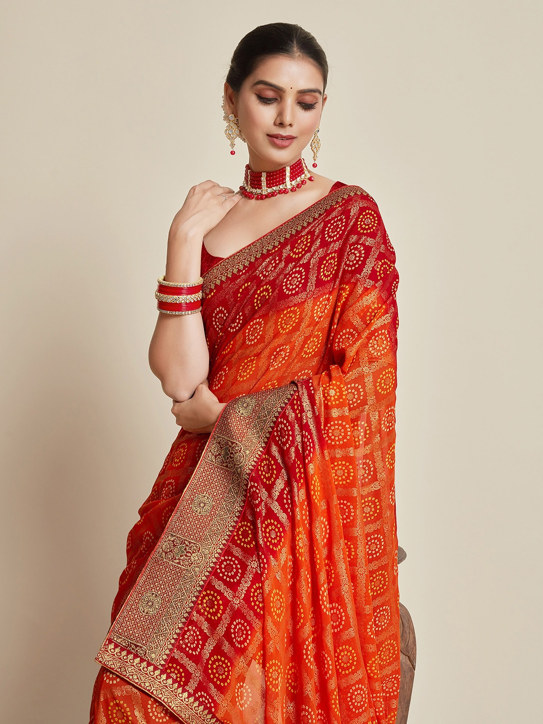 

Sangria Orange Printed Zari Pure Georgette Bandhani Saree