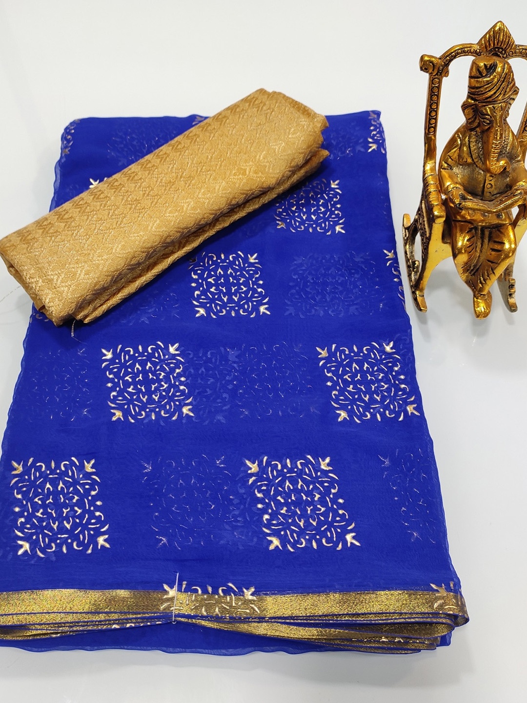 

Rhey Ethnic Motifs Printed Zari Chiffon Saree, Blue