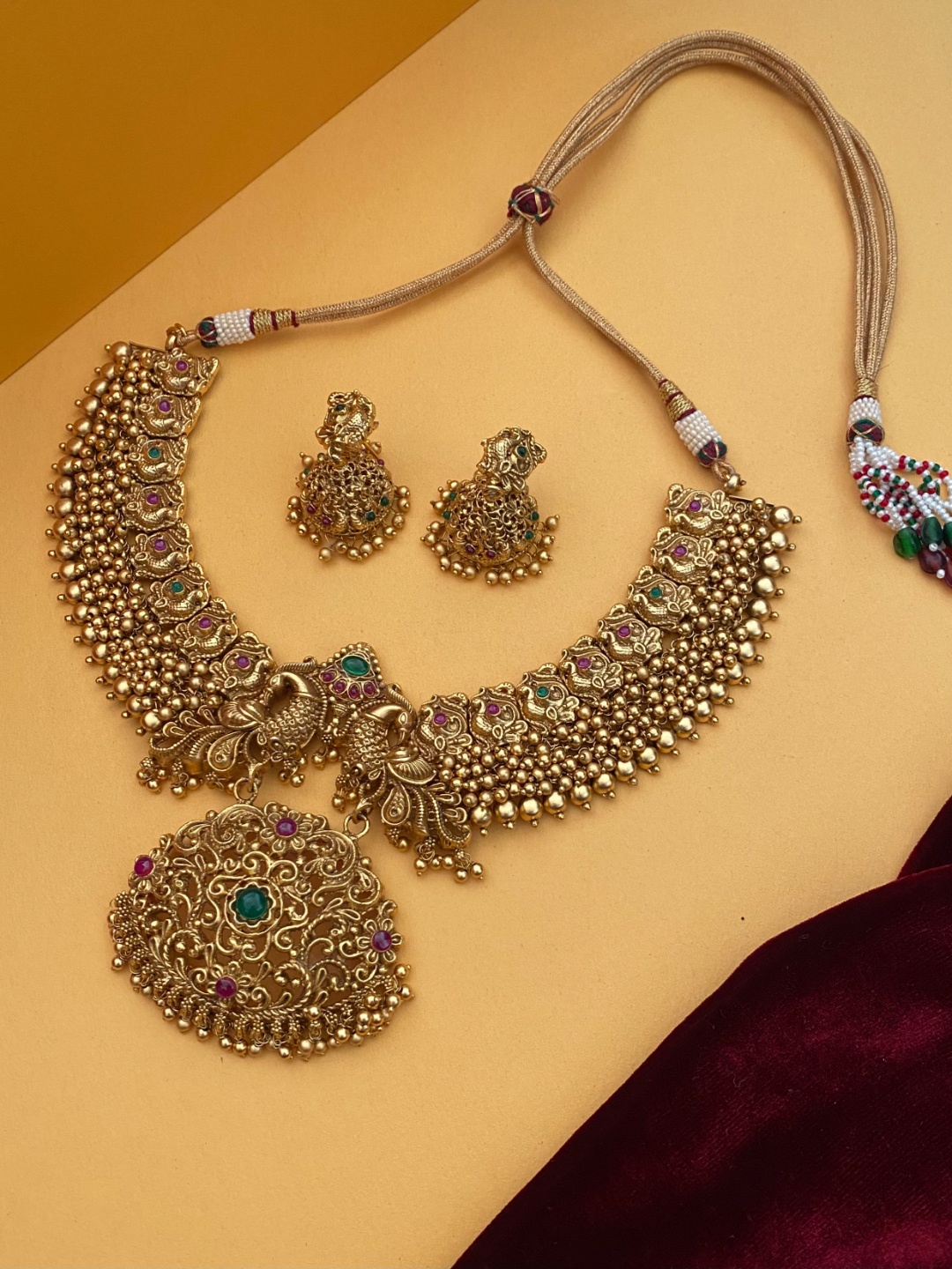 

Pihtara Jewels Gold-Plated Stone-Studded & Beaded Temple Jewellery Set