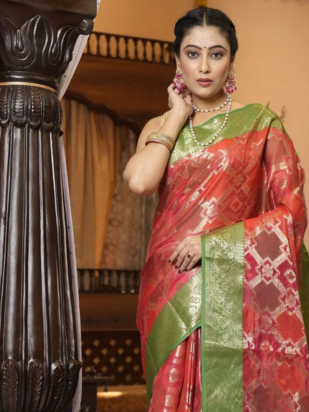 

Mitera Red & Green Ethnic Motifs Woven Design Zari Patola Saree