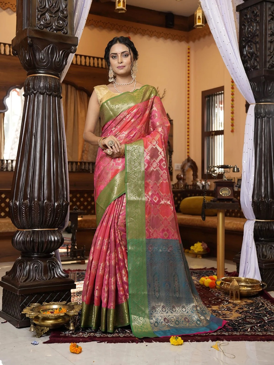 

Mitera Pink & Green Ethnic Motifs Woven Design Zari Patola Saree