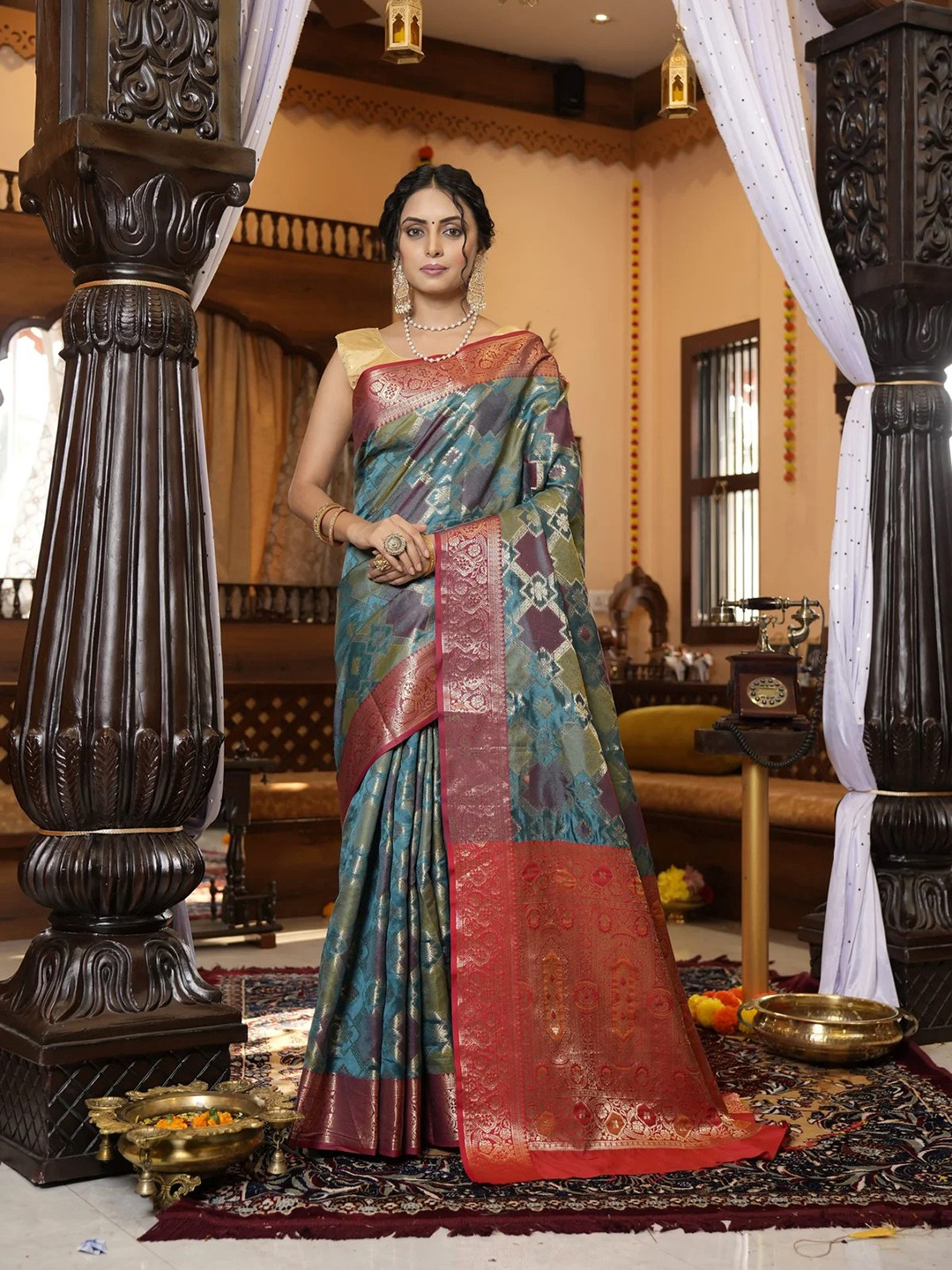 

Mitera Blue & Red Woven Design Zari Silk Blend Patola Saree