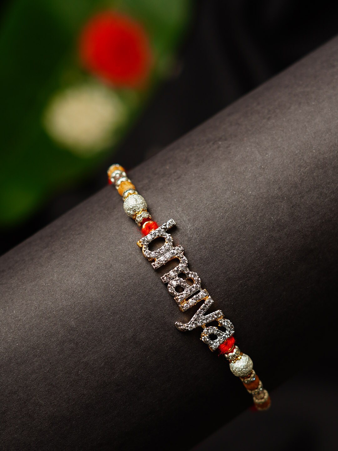 

Urmika Stone-Studded Bhaiya Text Rakhi With Roli Chawal, Red