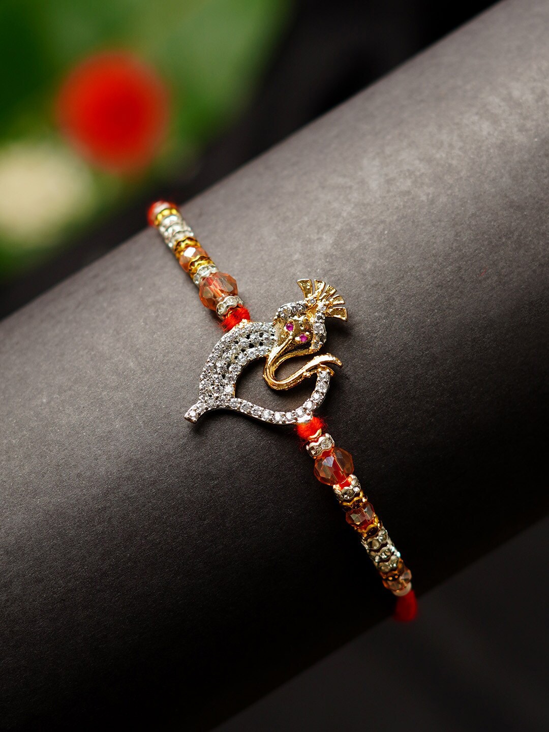

Urmika Shri Ganesh Crystal Religious Rakhi, Red