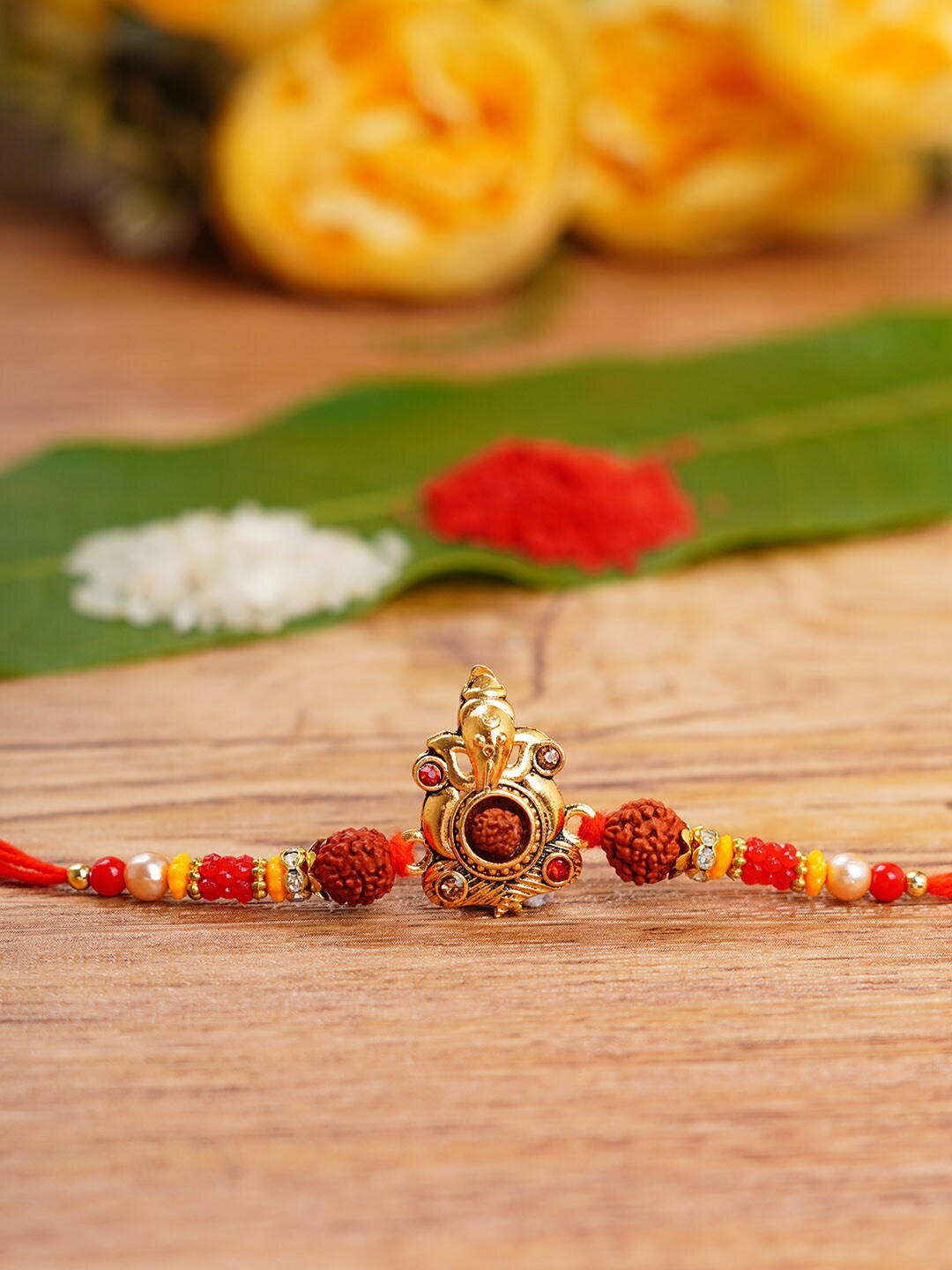 

Urmika Shri Ganesh Rudraksh Rakhi, Red