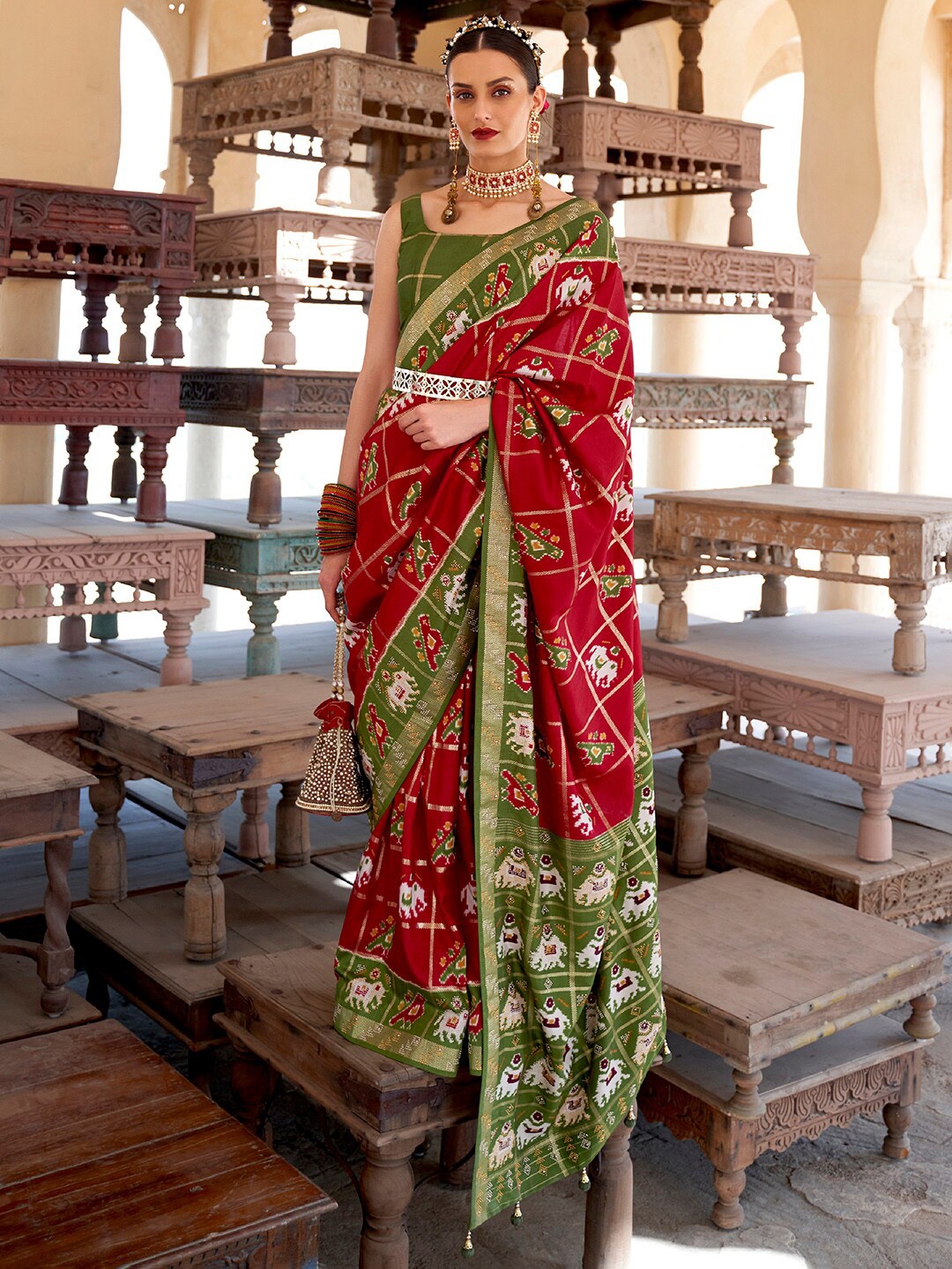

Anouk Red & Green Ethnic Motifs Printed Zari Patola Saree