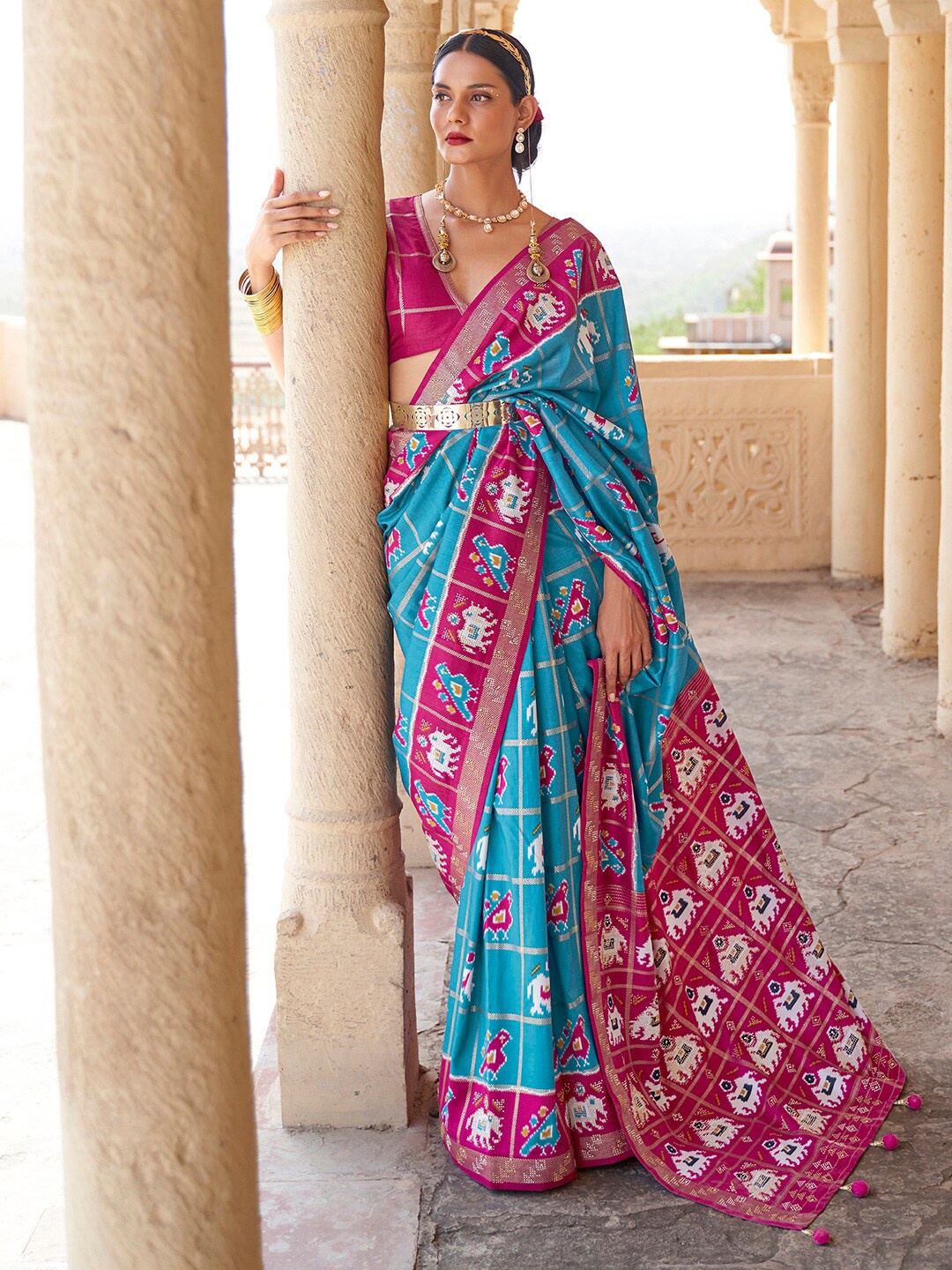 

Anouk Blue & Pink Ethnic Motifs Printed Zari Patola Saree