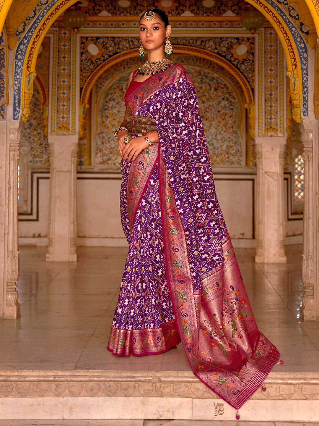 

Anouk Purple & Magenta Ethnic Motifs Printed Zari Patola Saree