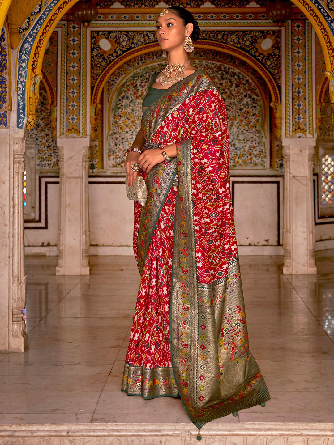 

Anouk Red & Green Ethnic Motifs Printed Zari Patola Saree