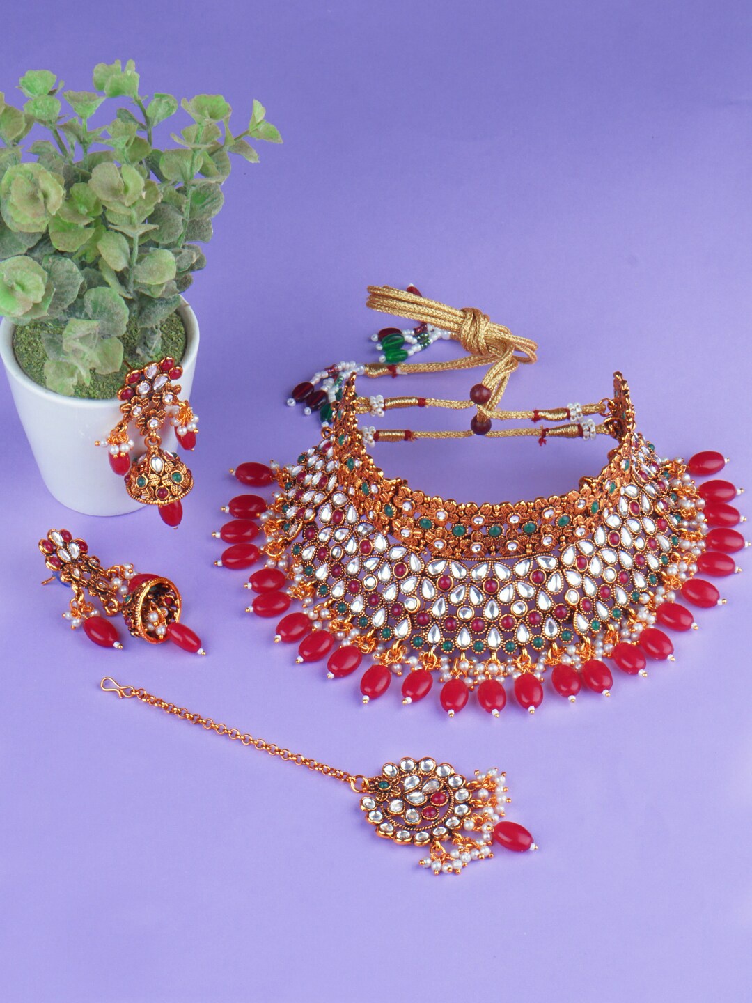 

Matushri Art Gold-Plated Stone-Studded & Beaded Jewellery Set