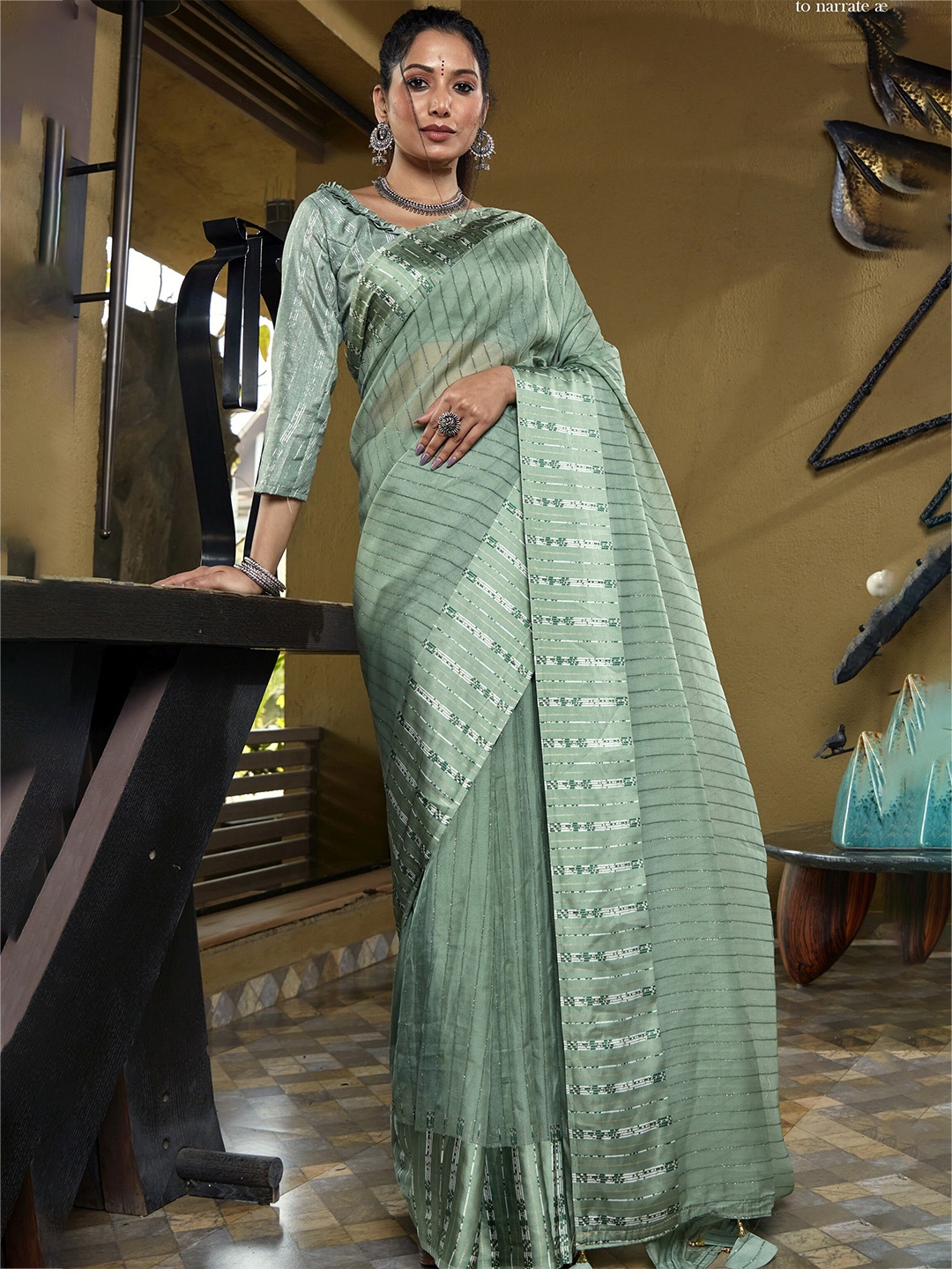 

Triveni Green & Silver-Toned Striped Organza Saree