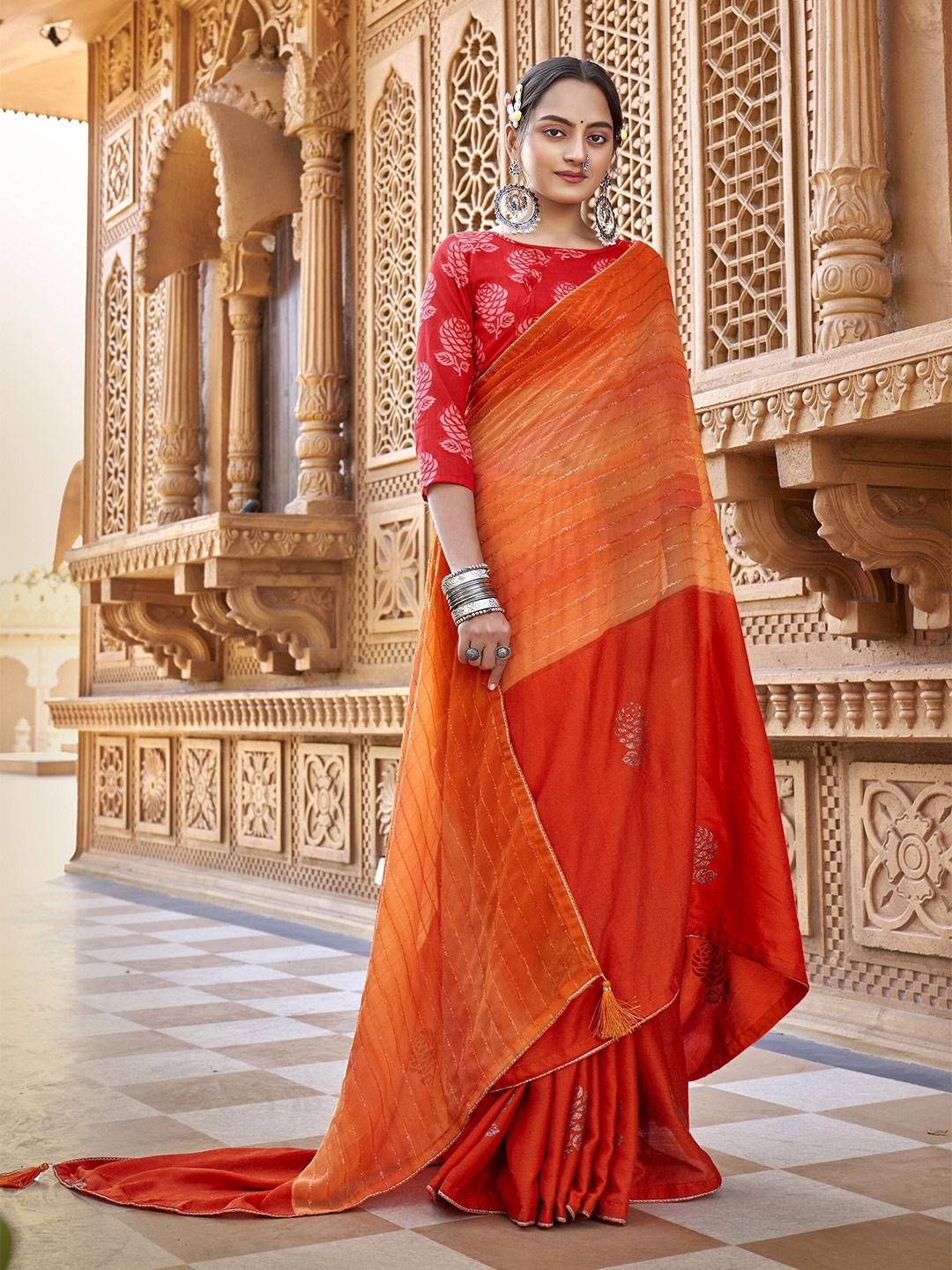 

Triveni Orange & Red Striped Pure Georgette Saree