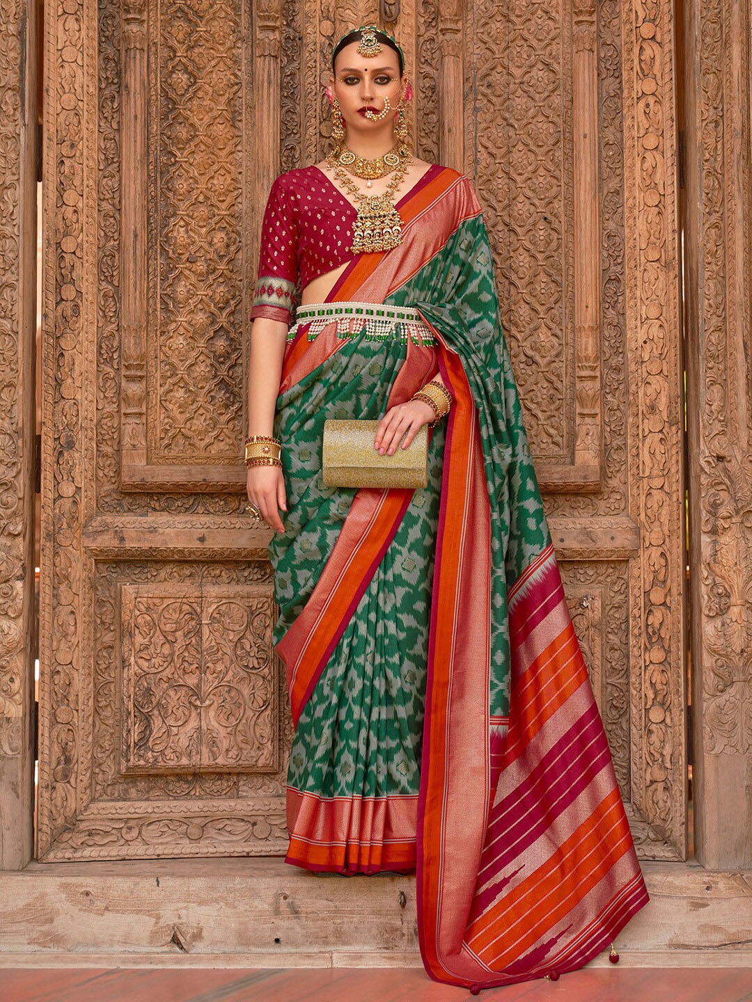 

Anouk Green & Red Ethnic Motifs Woven Design Zari Banarasi Saree