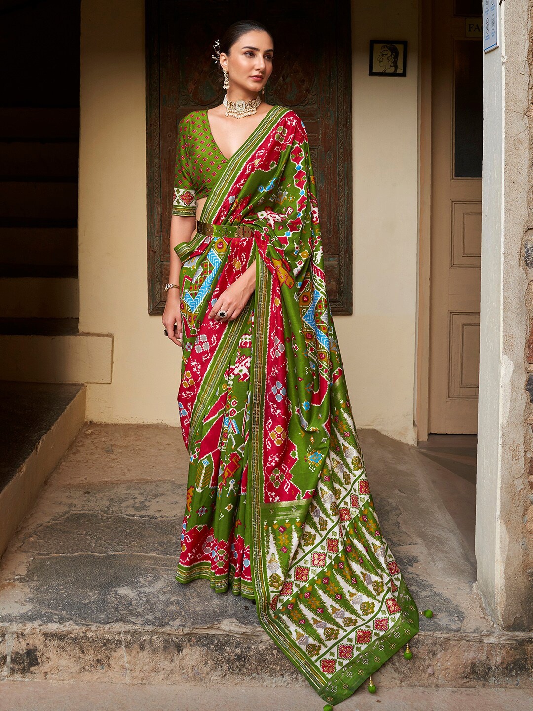 

Anouk Green & Pink Ethnic Motifs Printed Tasseled Patola Saree