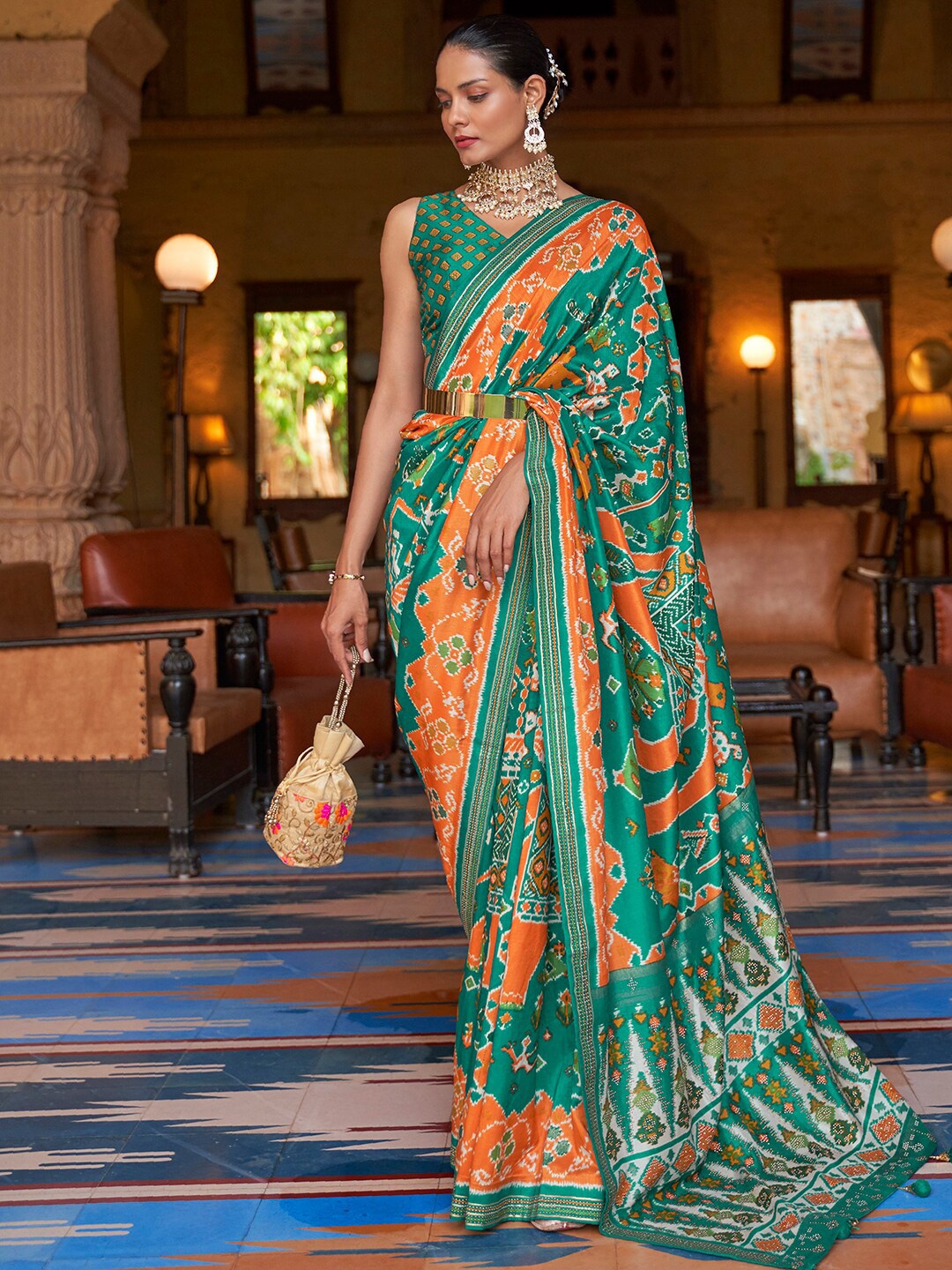 

Anouk Sea Green & Orange Ethnic Motifs Printed Patola Saree