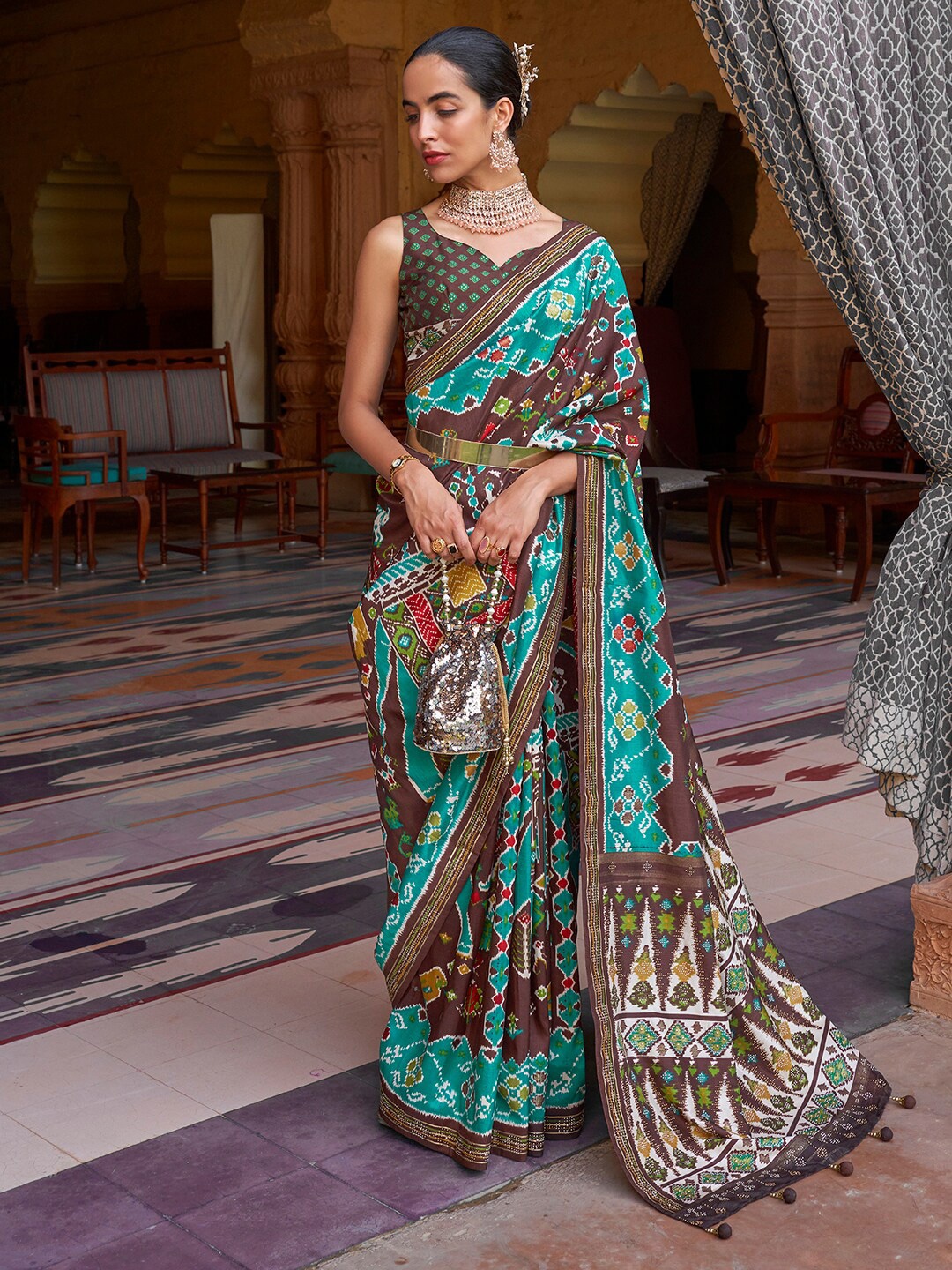 

Anouk Brown & Green Ethnic Motifs Printed Patola Saree