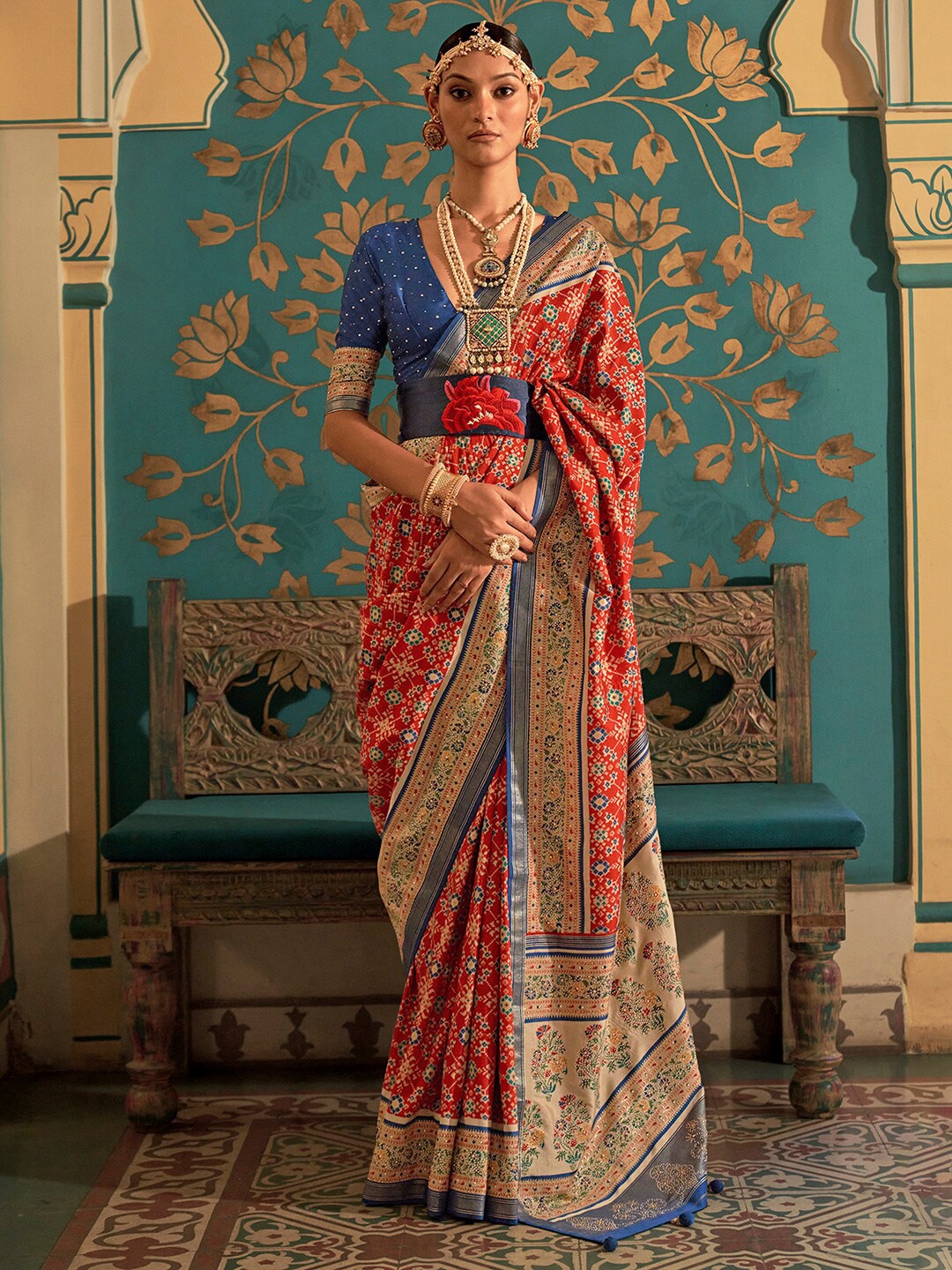 

Anouk Red & Blue Ethnic Motifs Printed Zari Banarasi Saree