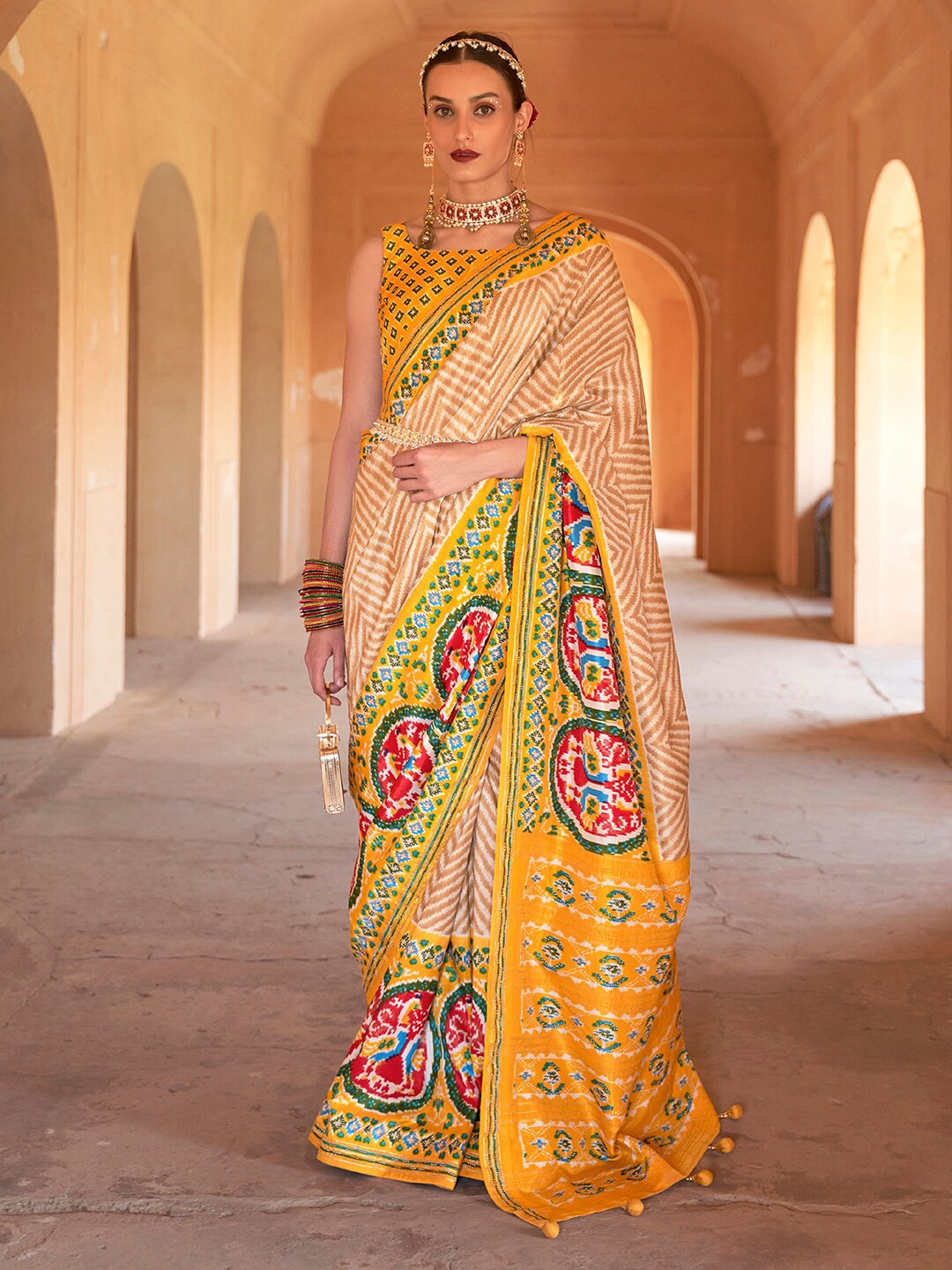 

Anouk Beige & Yellow Chevron Printed Beads and Stones Patola Saree