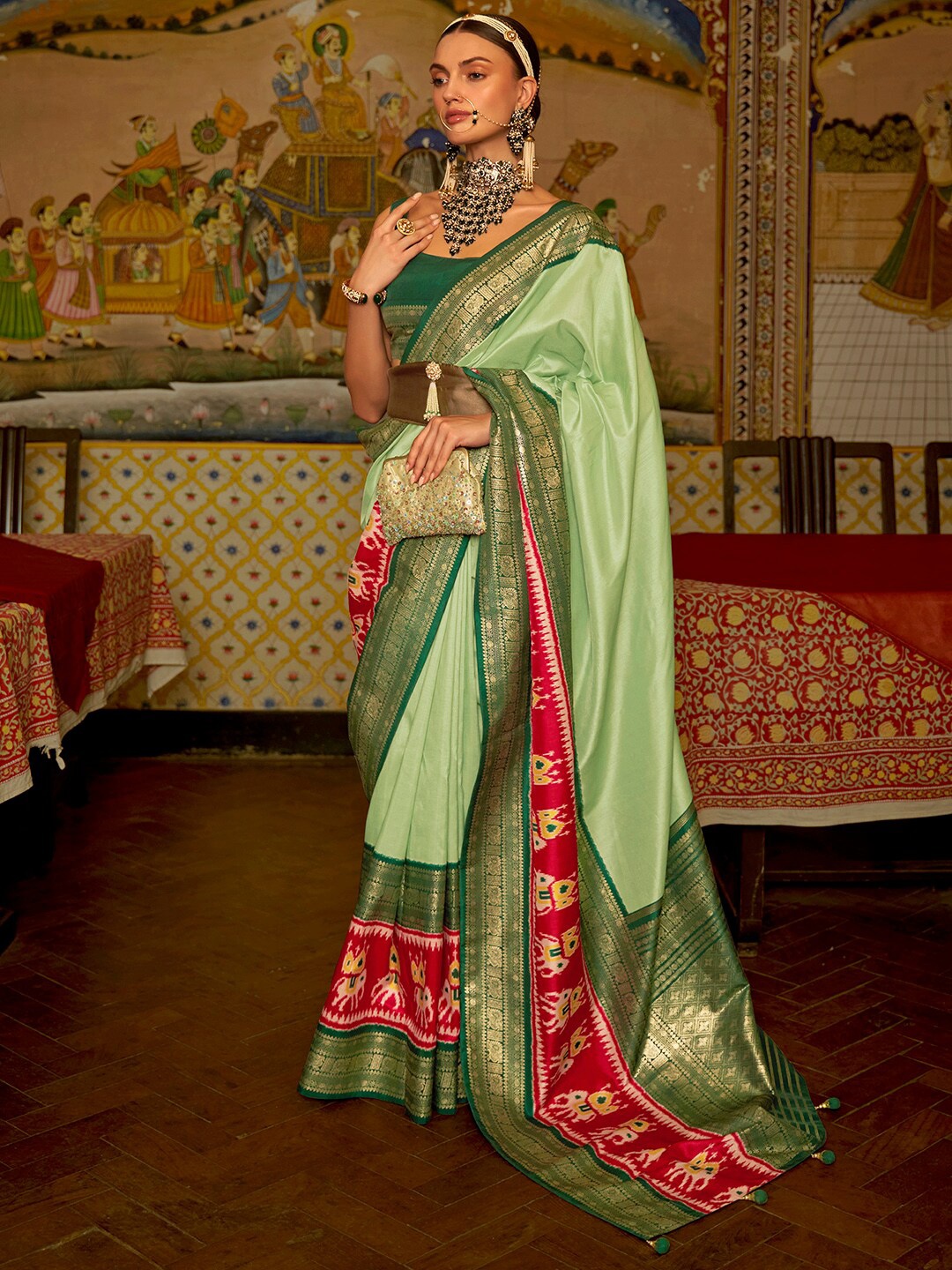 

Anouk Green & Red Ethnic Motifs Woven Design Patola Saree
