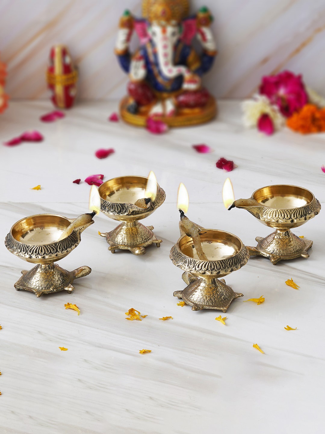 

eCraftIndia Gold-Toned 4 Pieces Decorative Brass Diyas with Tortoise Base