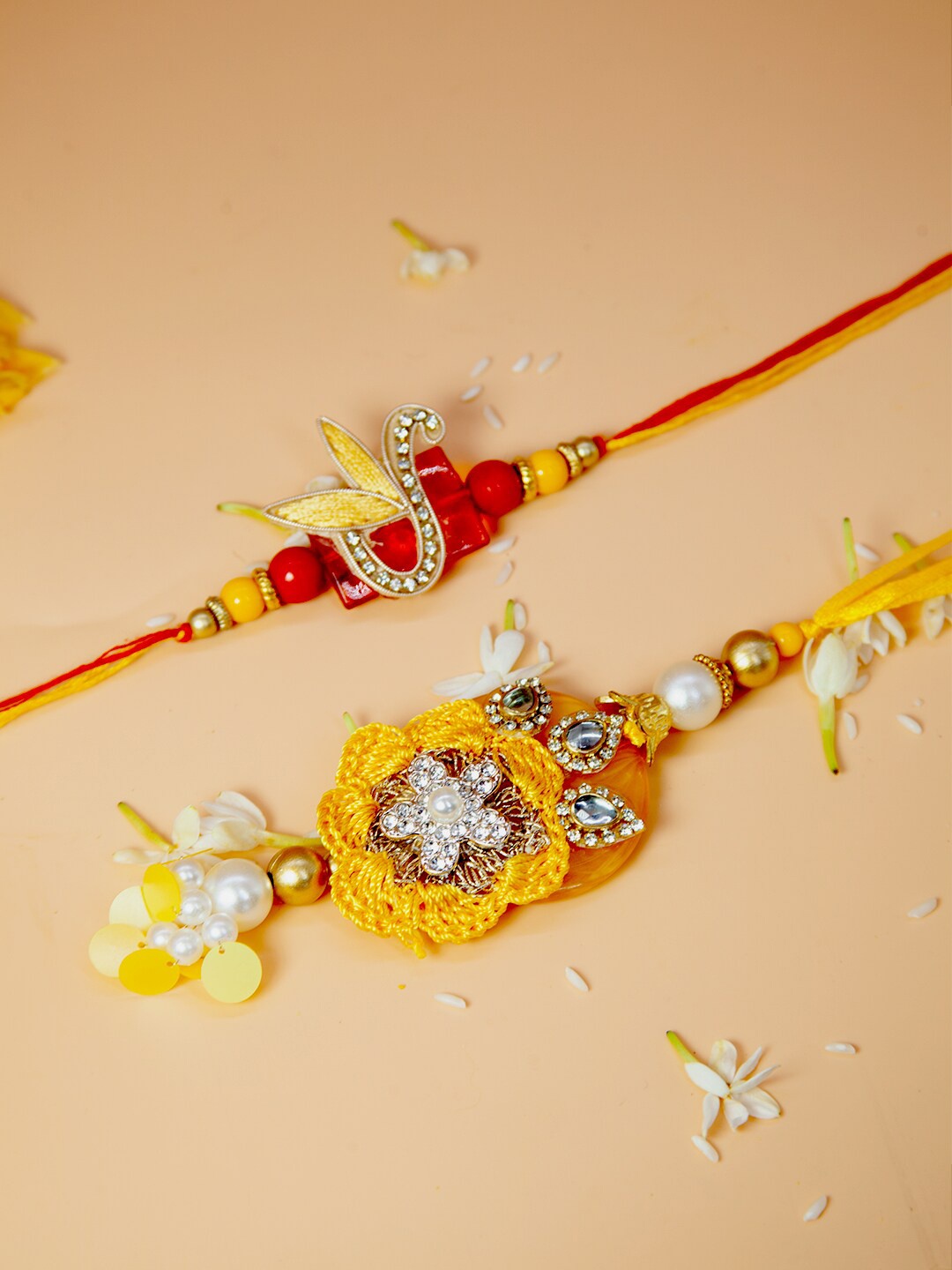 

Fida Set of 2 Kundan With Pearl Studded Lumba Rakhi, Red