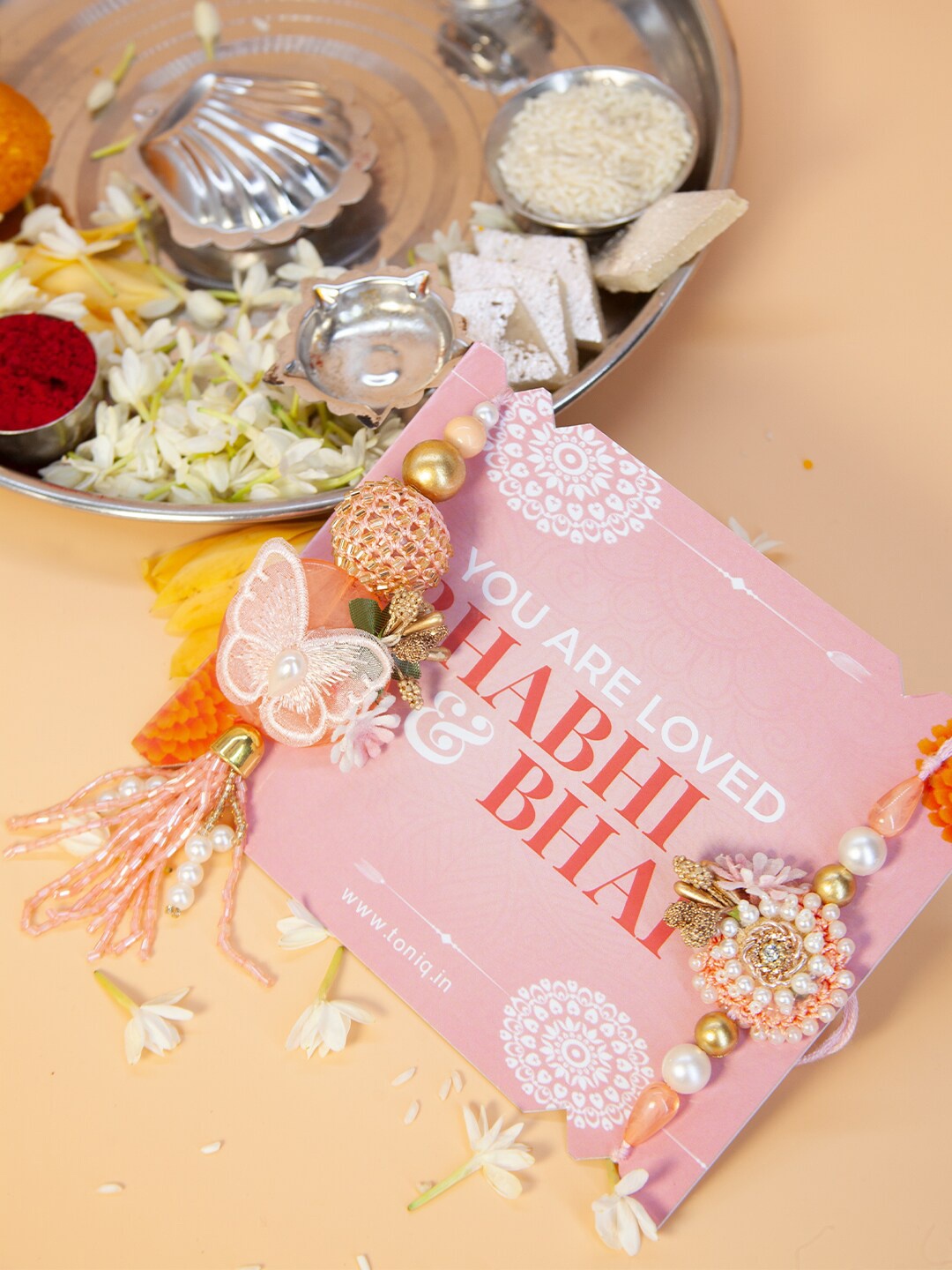 

Fida Handmade Butterfly Floral Pearl & Stone Studded Lumba Rakhi with Roli Chawal, Pink