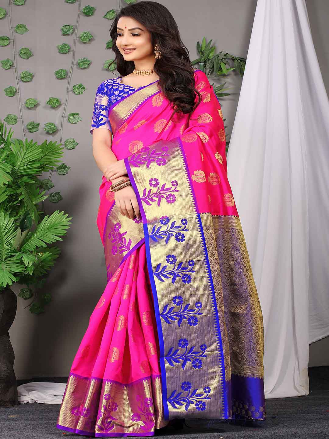 

Mitera Pink & Blue Ethnic Motifs Woven Design Zari Saree