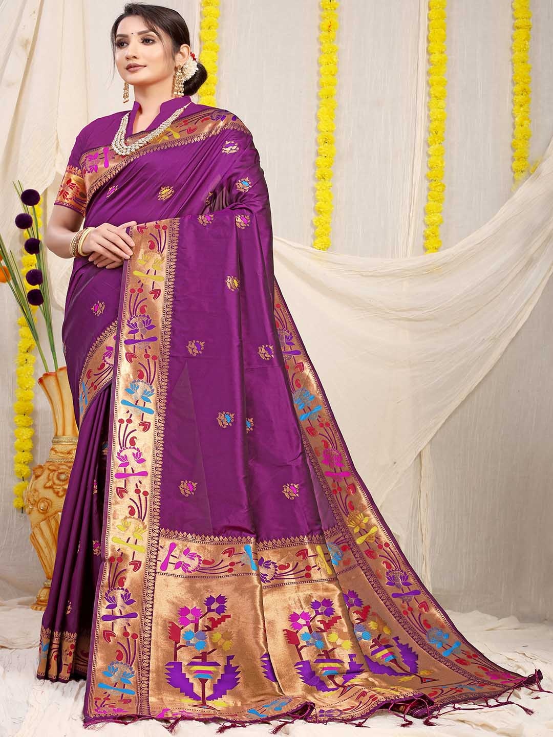 

Mitera Purple Ethnic Motifs Printed Art Silk Saree