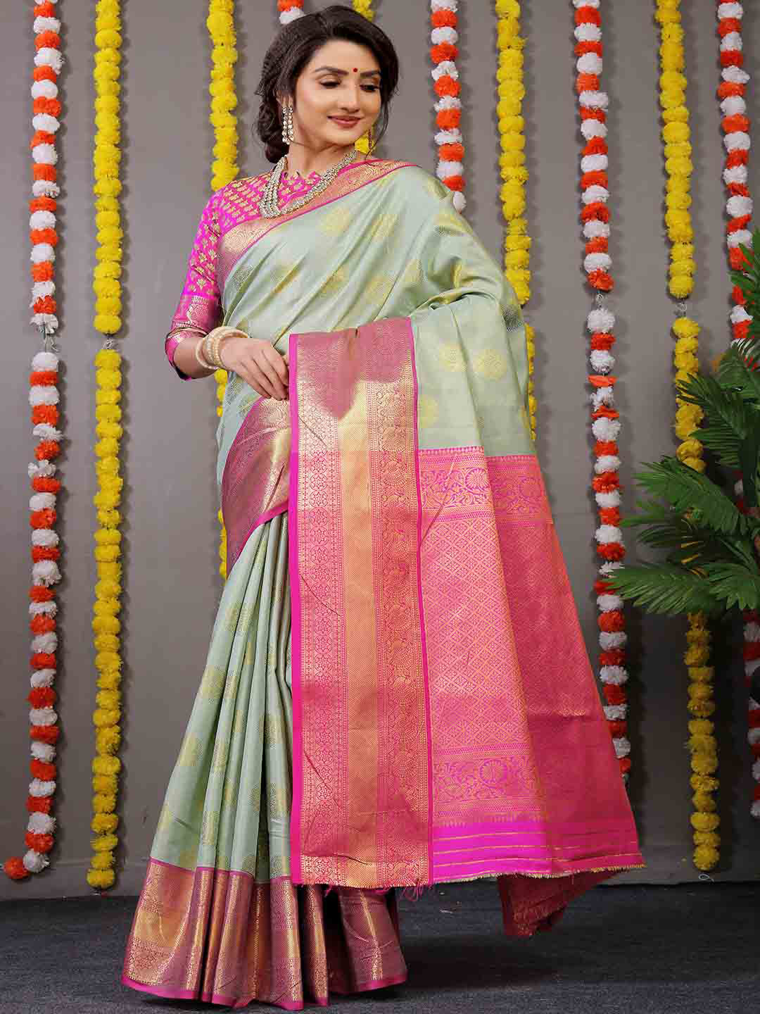 

Mitera Green & Pink Ethnic Motifs Printed Art Silk Saree