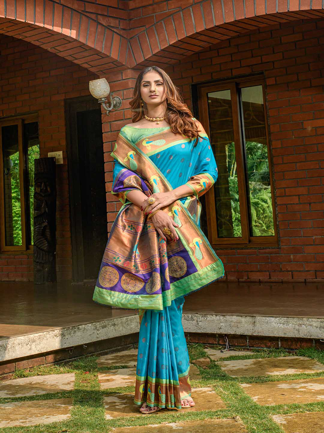 

Mitera Sky Blue & Gold-Toned Ethnic Motifs Woven Design Zari Saree