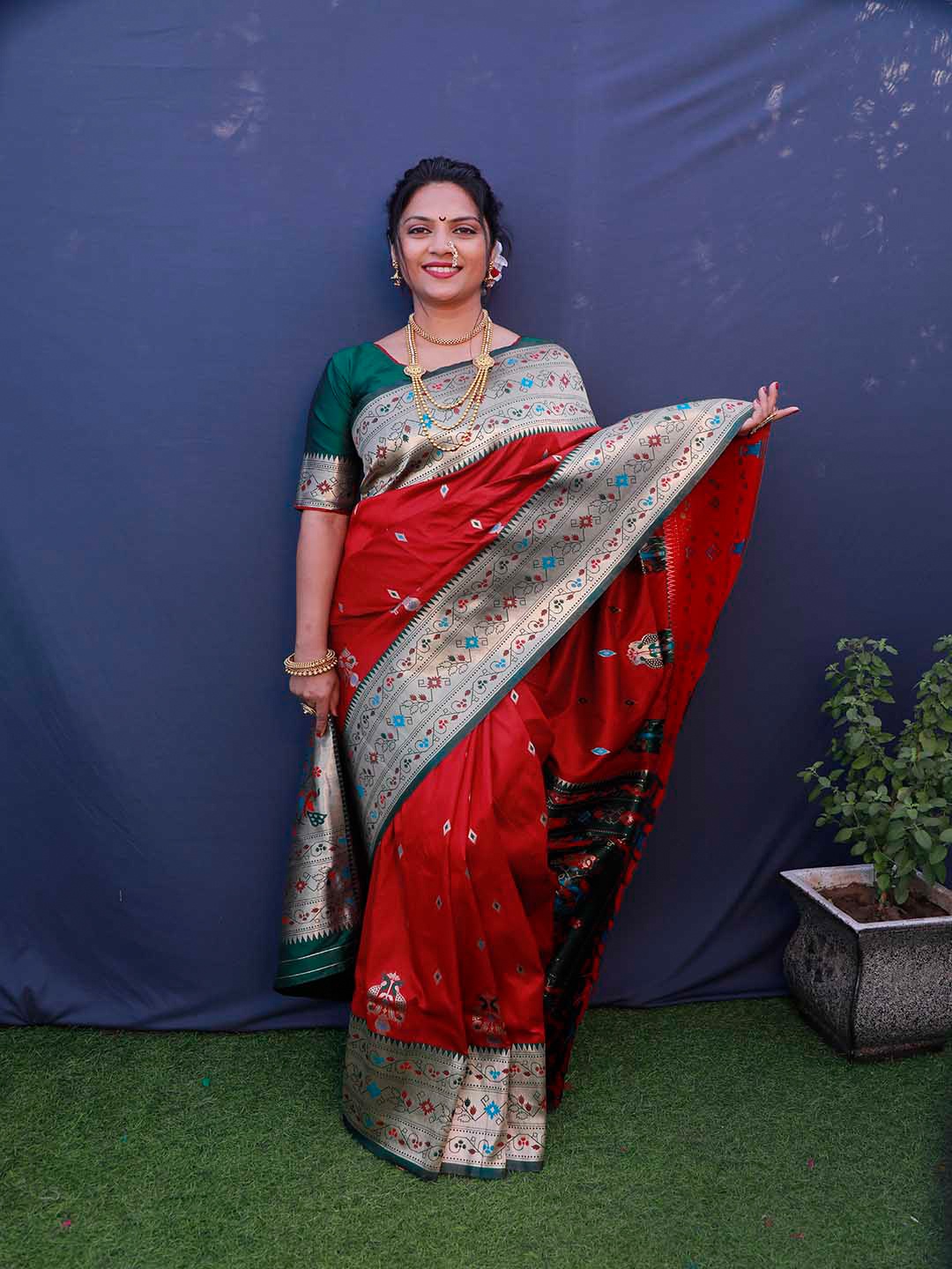 

Mitera Red & Silver-Toned Ethnic Motifs Woven Design Zari Saree