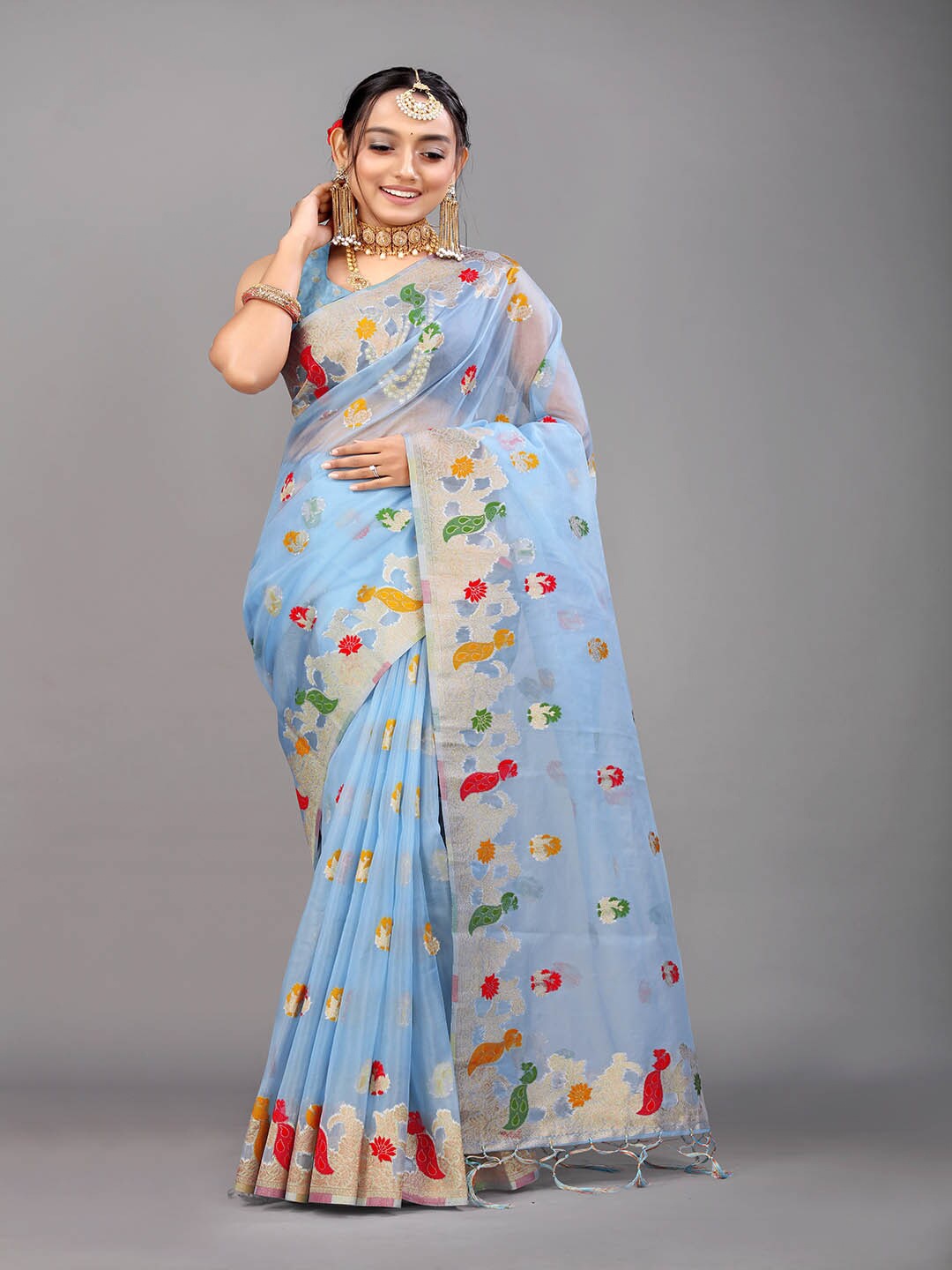 

Mitera Light Blue & Red Ethnic Motifs Woven Design Zari Saree