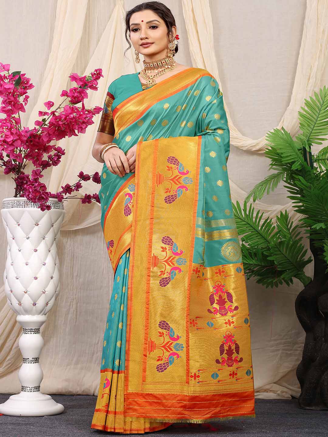 

Mitera Blue & Gold-Toned Ethnic Motif Woven Design Saree