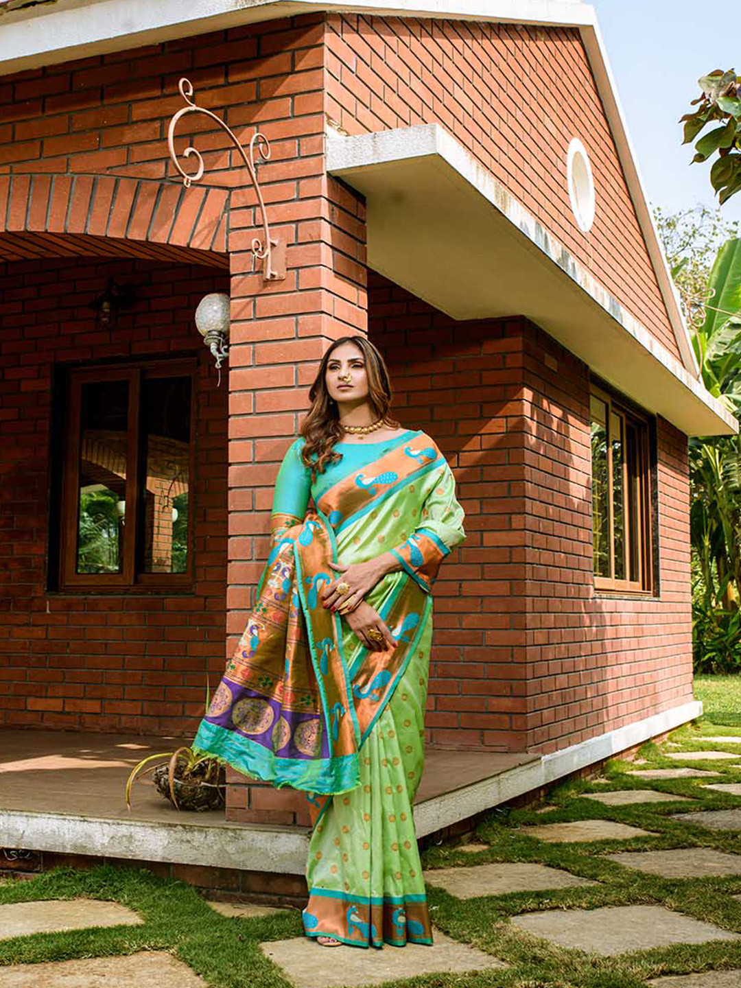 

Mitera Light Green & Gold-Toned Ethnic Motifs Woven Design Zari Saree