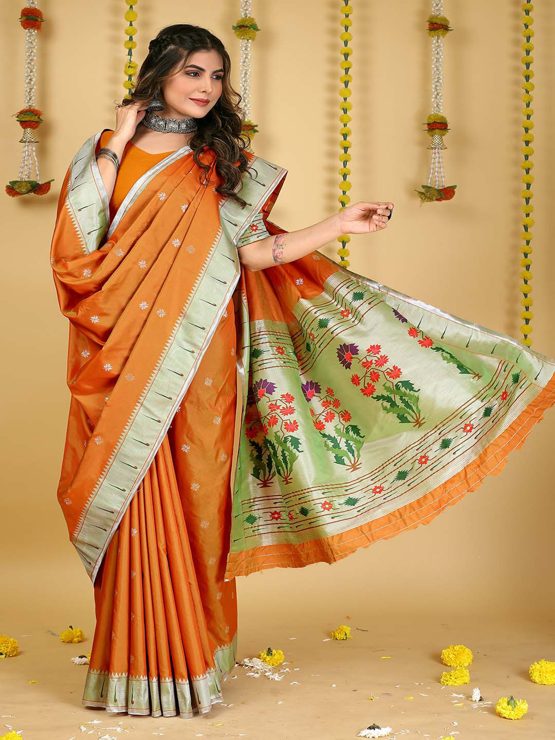 

Mitera Orange & Silver-Toned Ethnic Motifs Woven Design Zari Saree