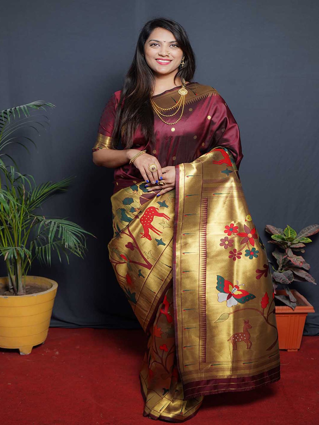 

Mitera Maroon & Gold-Toned Ethnic Motifs Woven Design Zari Saree