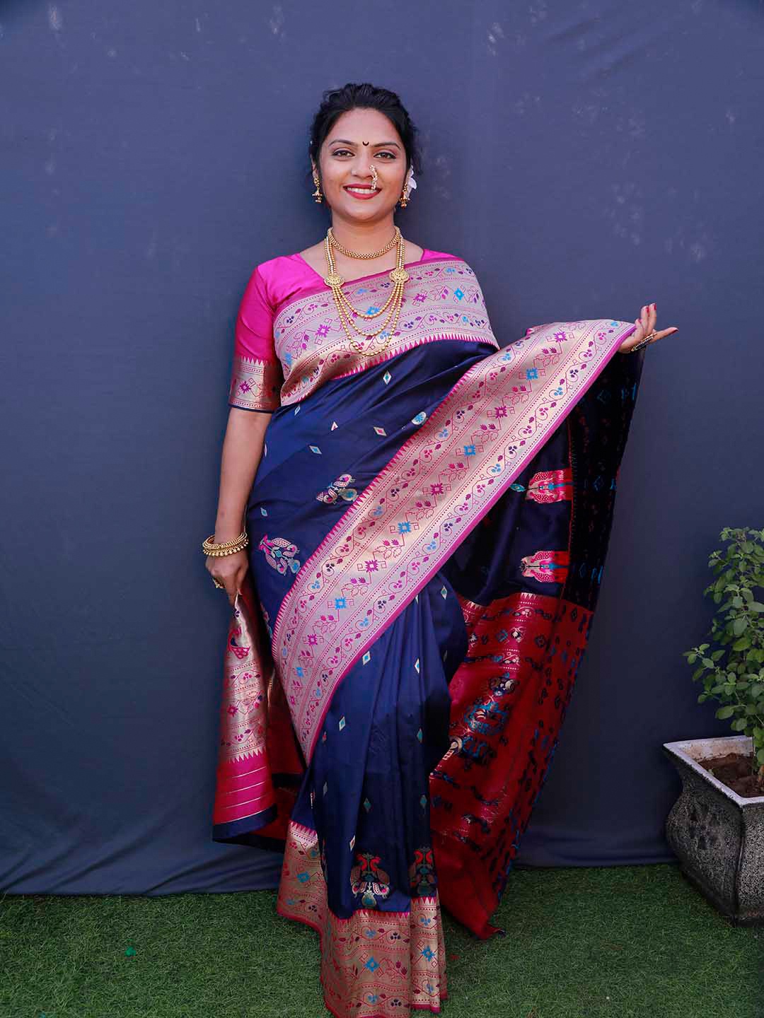 

Mitera Blue & Pink Woven Design Zari Art Silk Saree