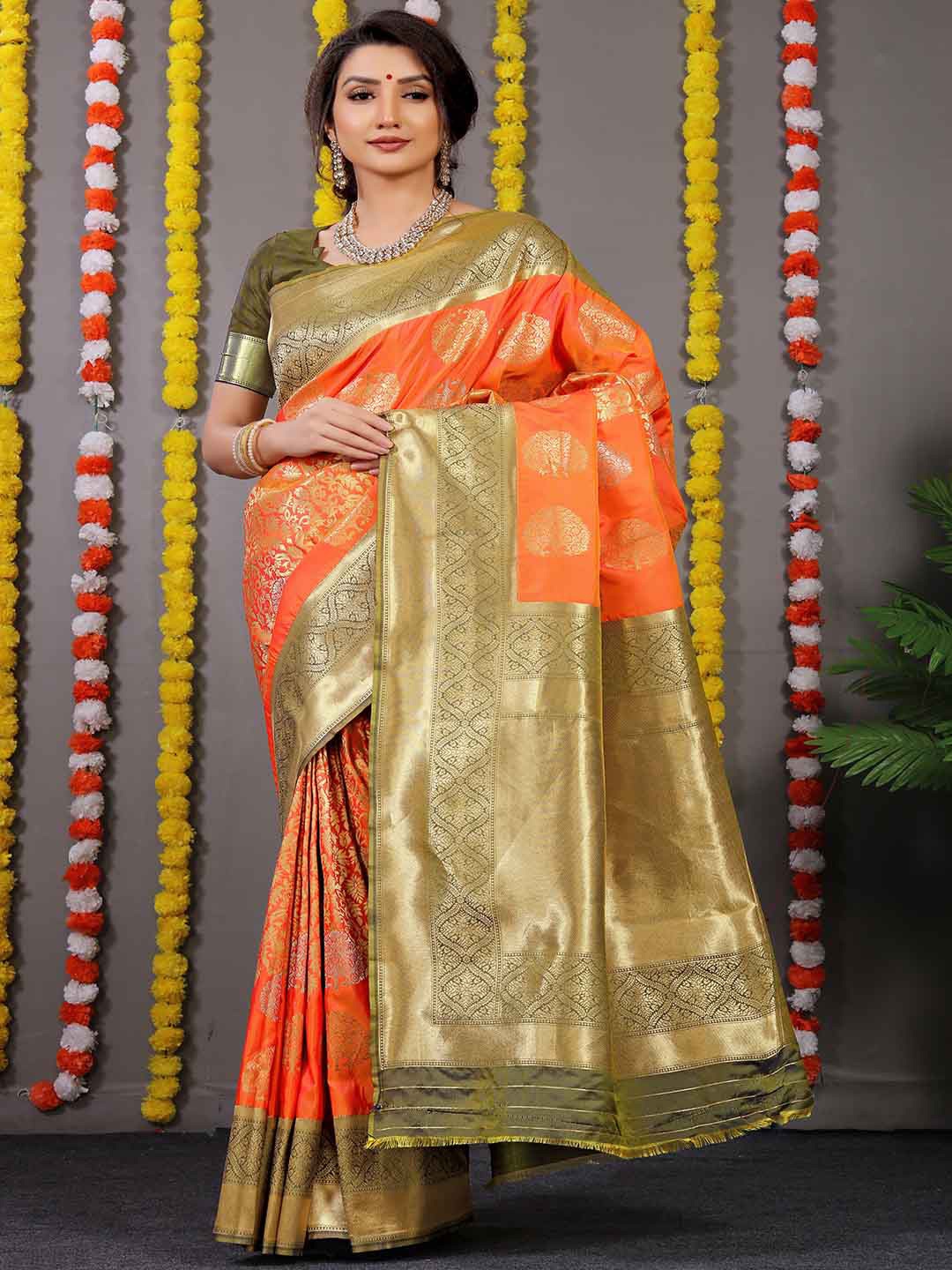 

Mitera Orange & Green Ethnic Motif Woven Design Zari Saree