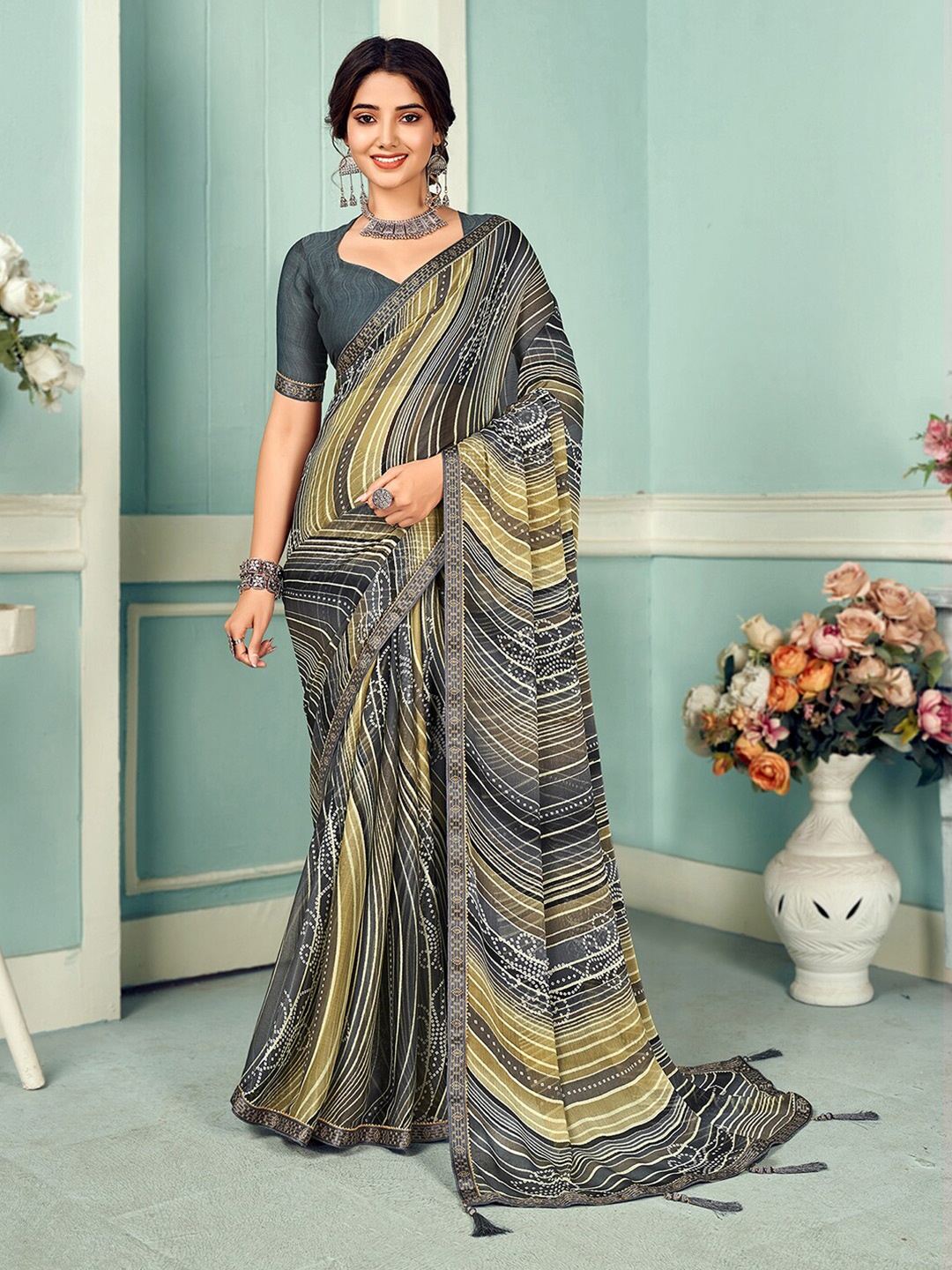 

Mitera Grey & Olive Green Ethnic Motifs Printed Poly Chiffon Saree