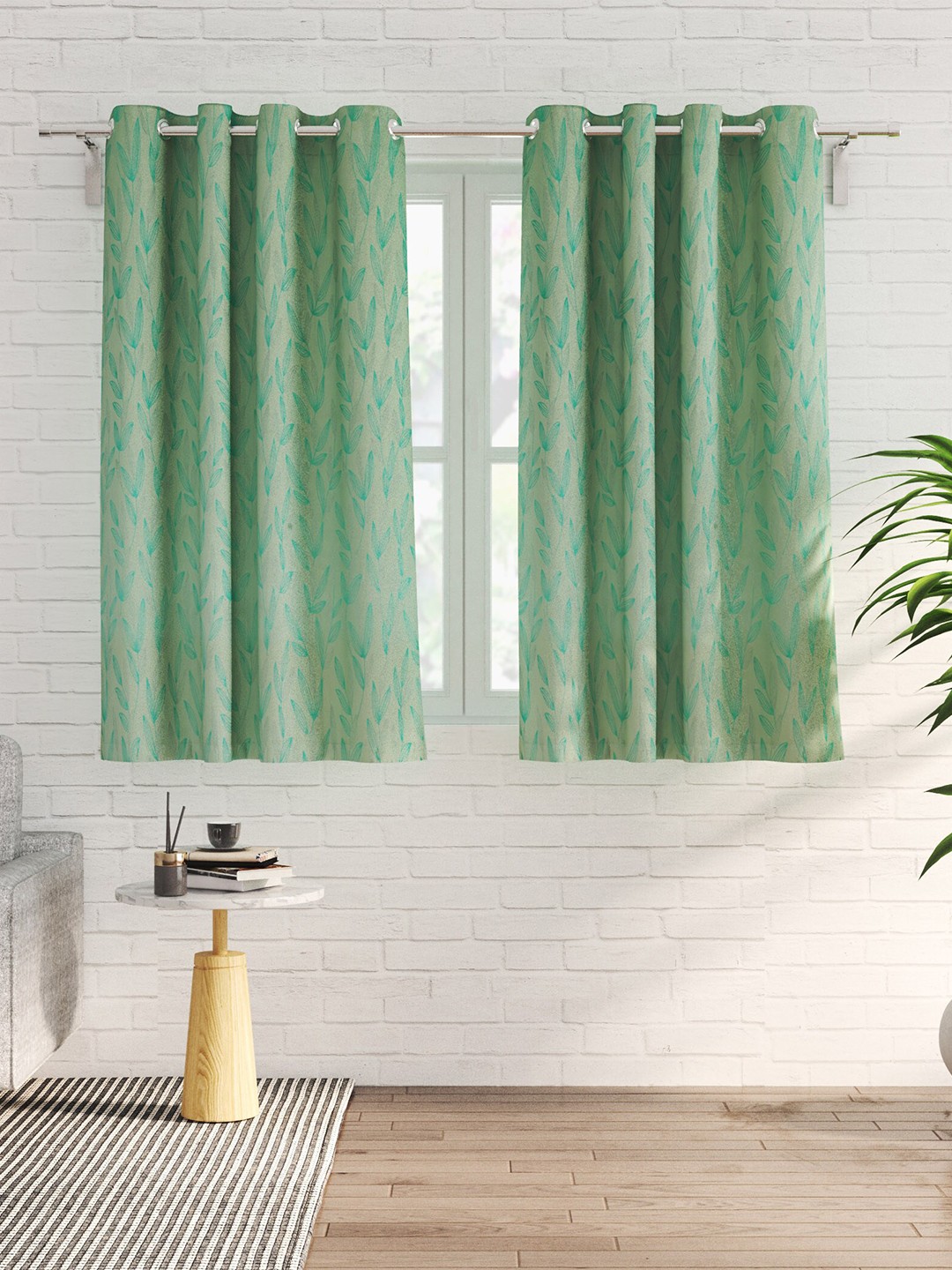 

Home Centre Green 2 Pieces Floral Black Out Window Curtains