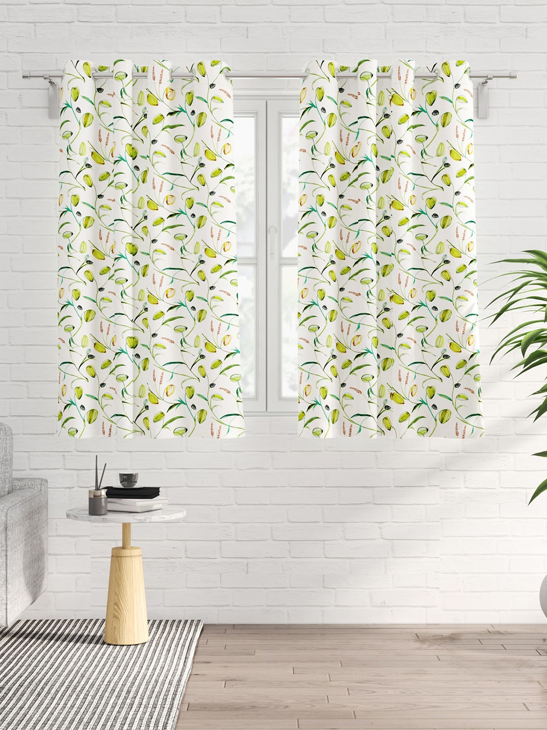 

Home Centre Saddle White & Green 2 Pieces Floral Black Out Window Curtains