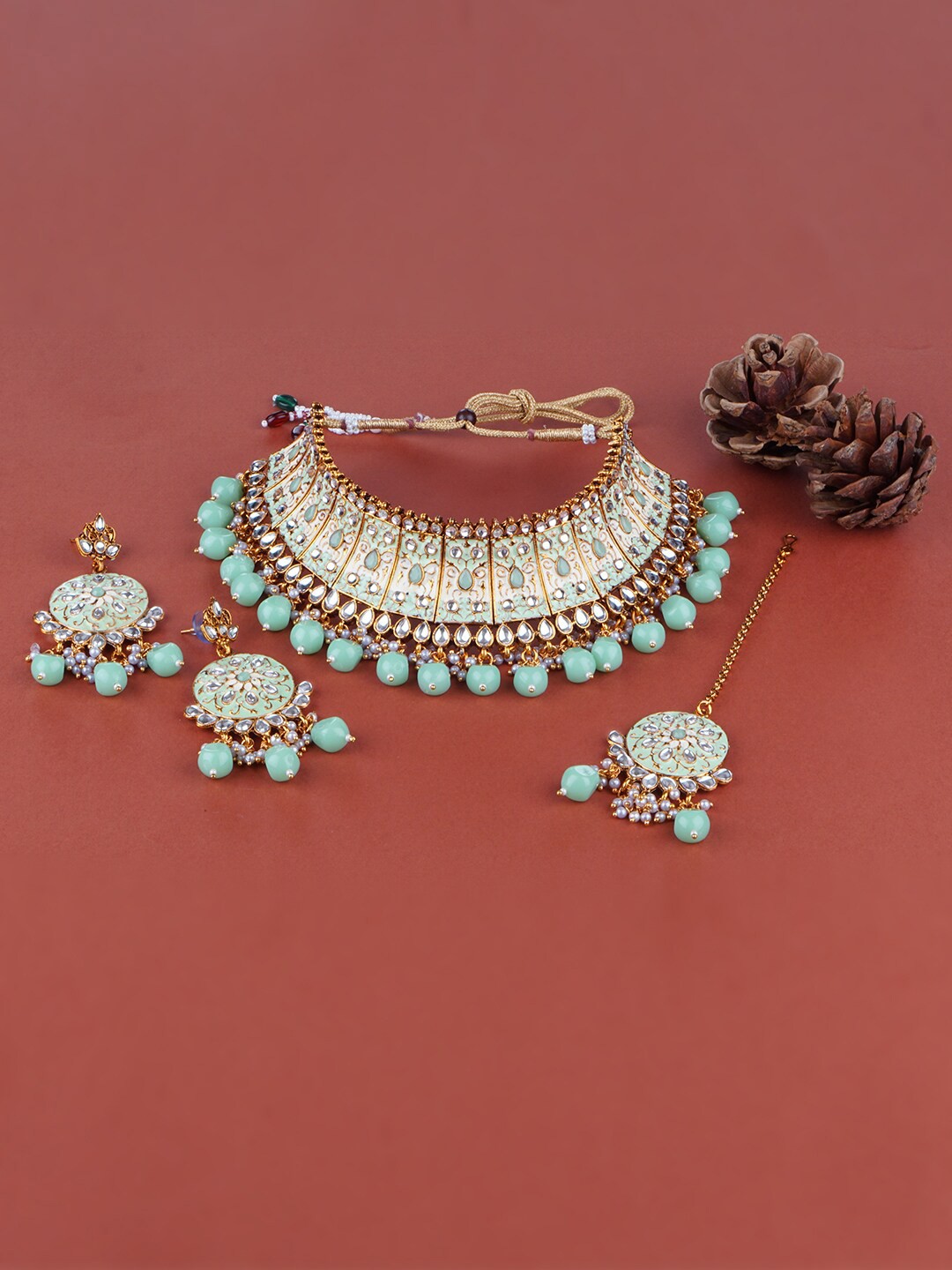 

Matushri Art Gold Plated Kundan Studded Choker Jewellery Set With Maang Tikka