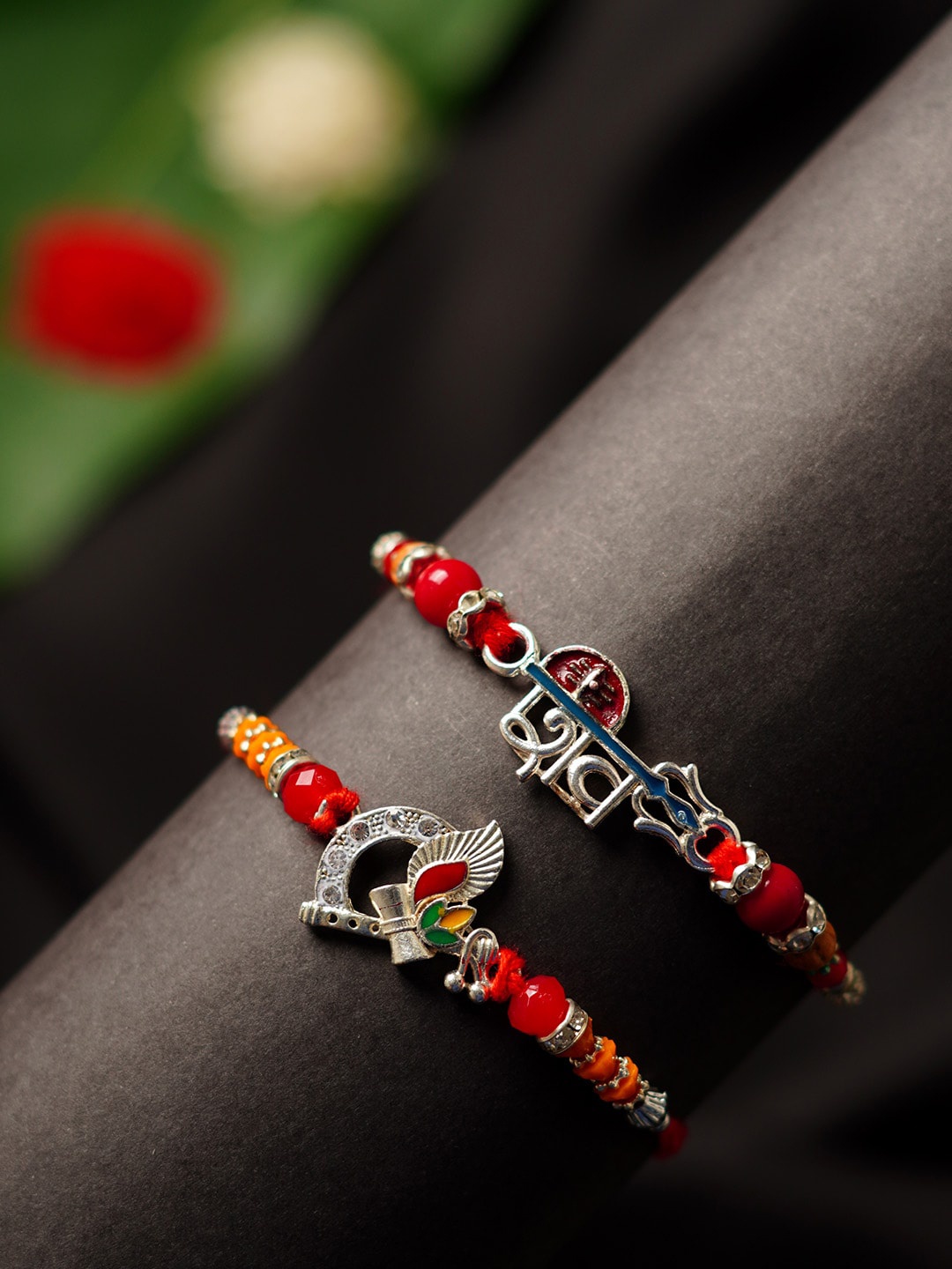 

Urmika Set of 2 Shiv & Bansuri Damroo Thread Rakhi, Red