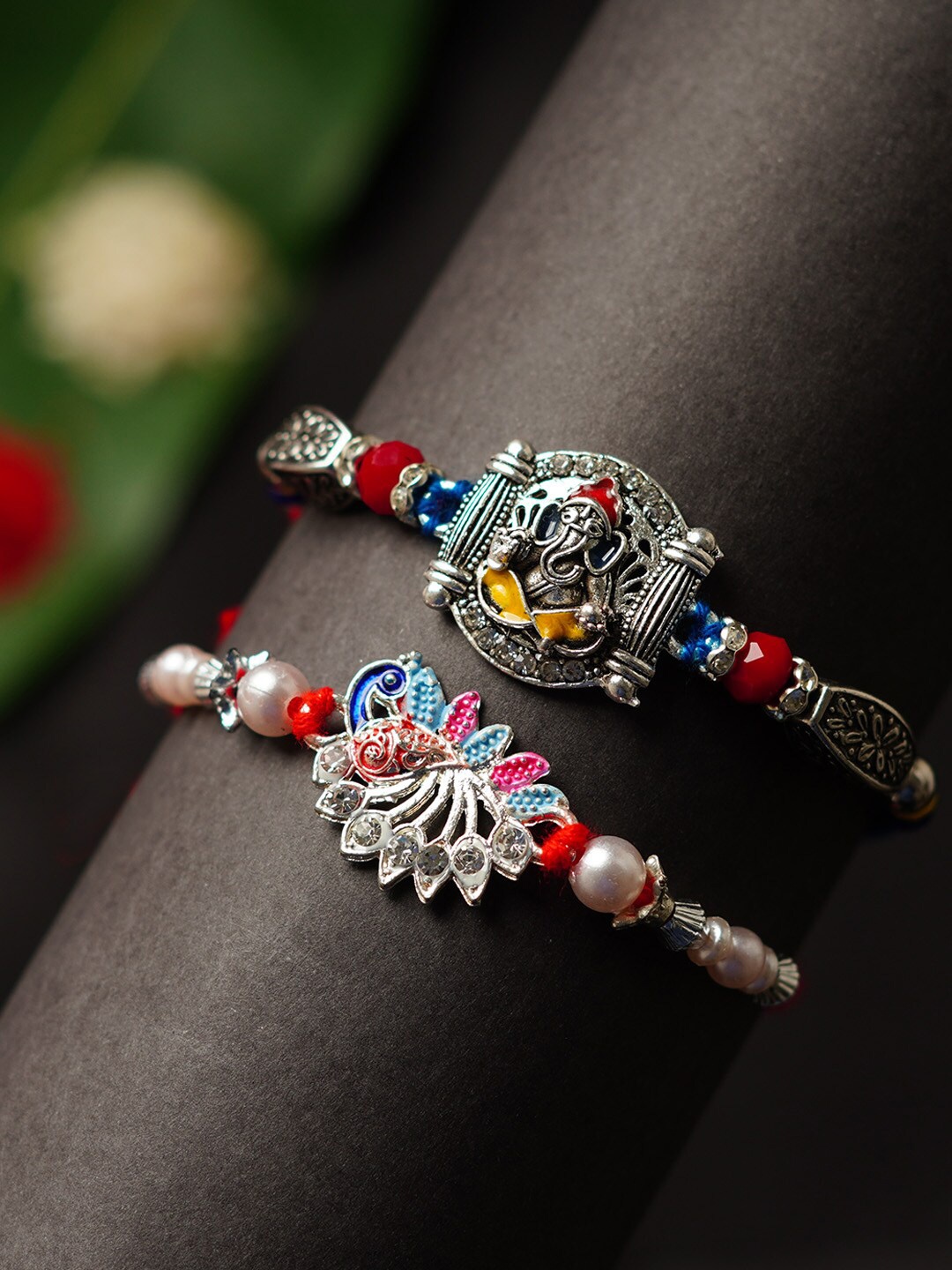 

Urmika Set of 2 Shri Ganesh & Peacock Rakhis, Red