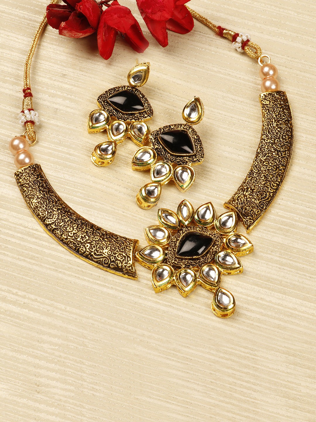 

Priyaasi Antique Gold-Toned & Black Kundan Stone-Studded Jewellery Set