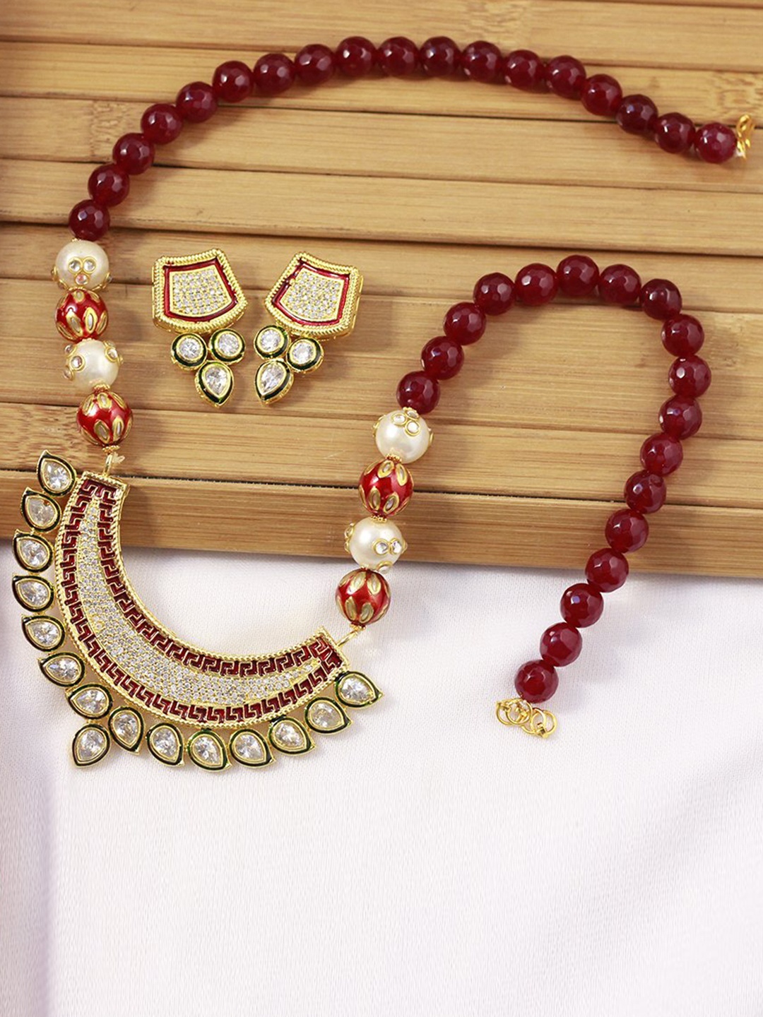 

Priyaasi Maroon & Gold-Toned Kundan Stone-Studded Jewellery Set