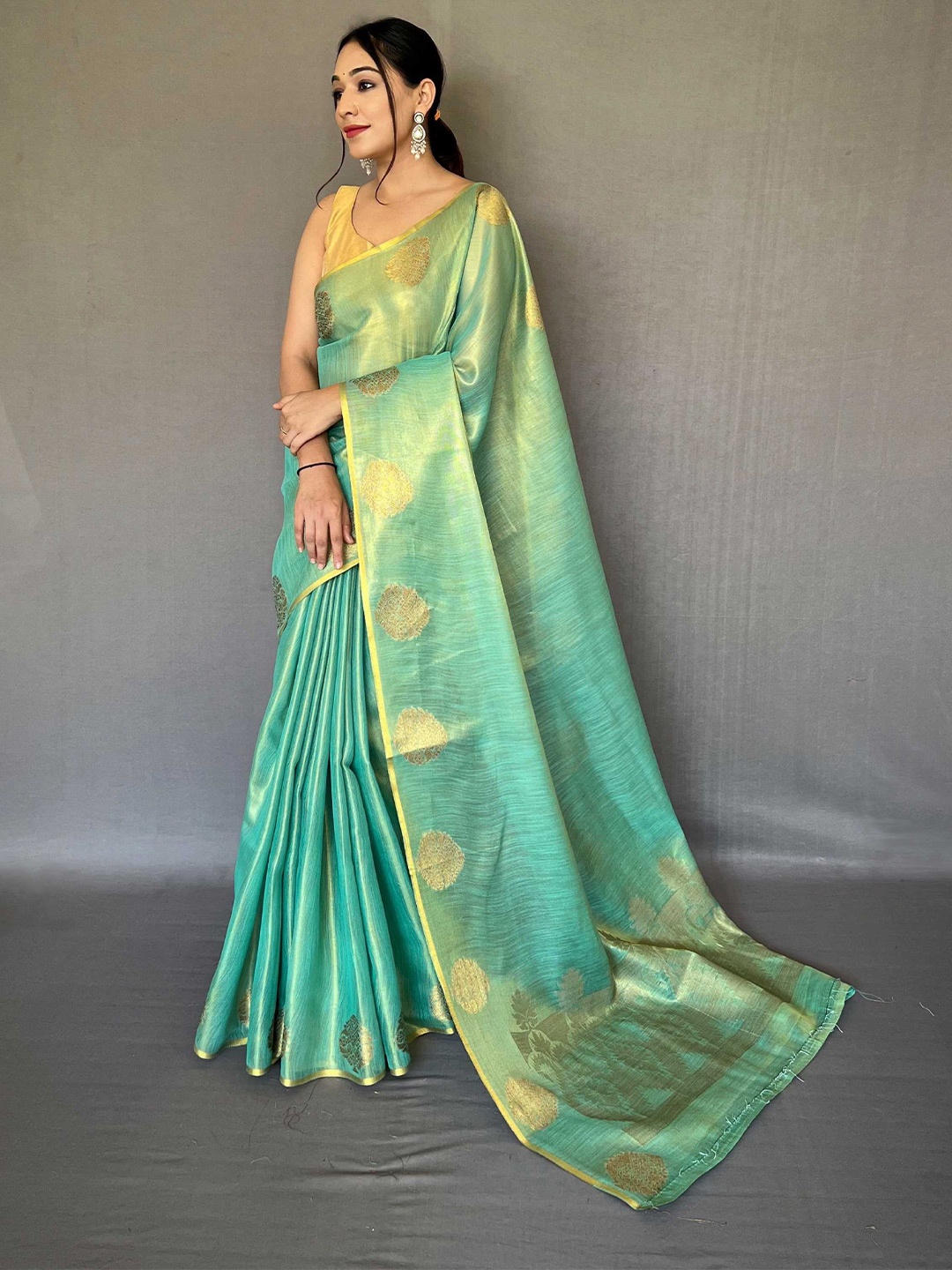 

Mitera Teal & Gold-Toned Ethnic Motifs Woven Design Zari Saree